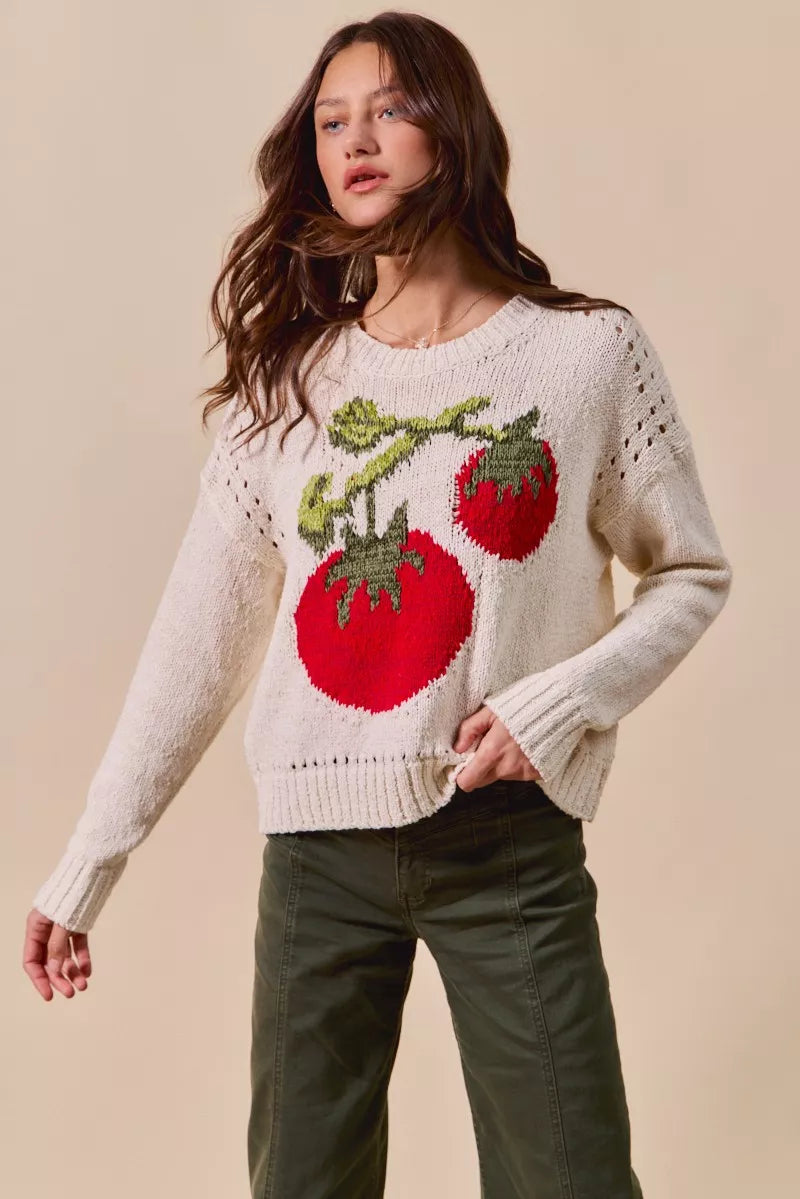 Tomato Vine Sweater – whimsical knit with red tomato design, round neck, ribbed cuffs, and eyelet details.