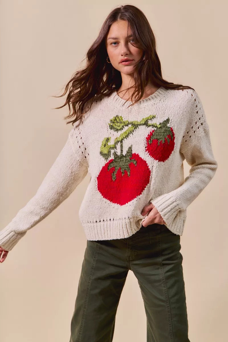 Tomato Vine Sweater – whimsical knit with red tomato design, round neck, ribbed cuffs, and eyelet details.