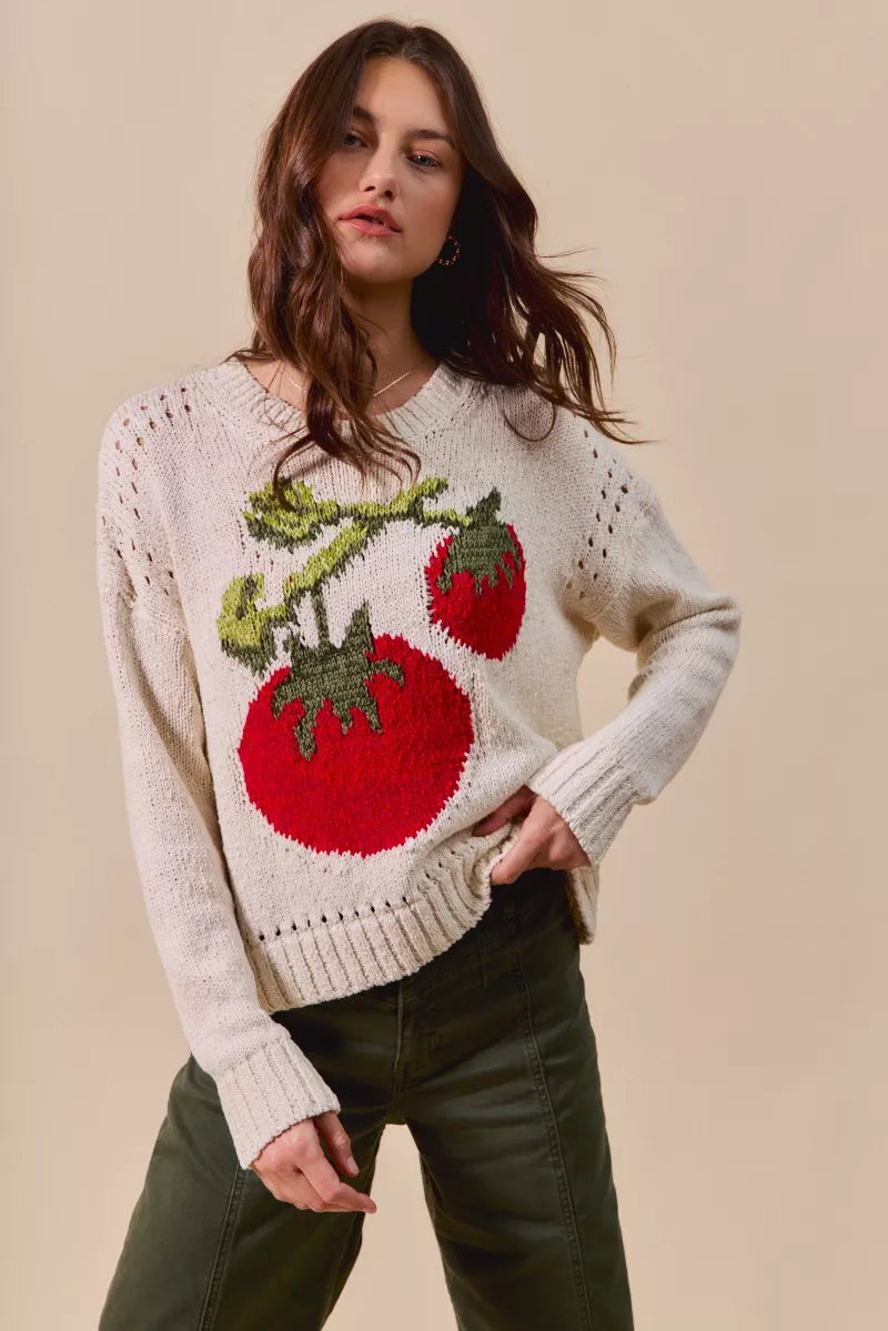 Tomato Vine Sweater – whimsical knit with red tomato design, round neck, ribbed cuffs, and eyelet details.