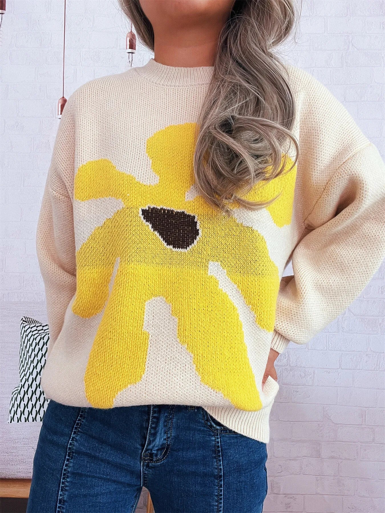 Apricot oversized sweater with trippy daisy flower design – Wavy Daisy style from A Whimsical Affair.