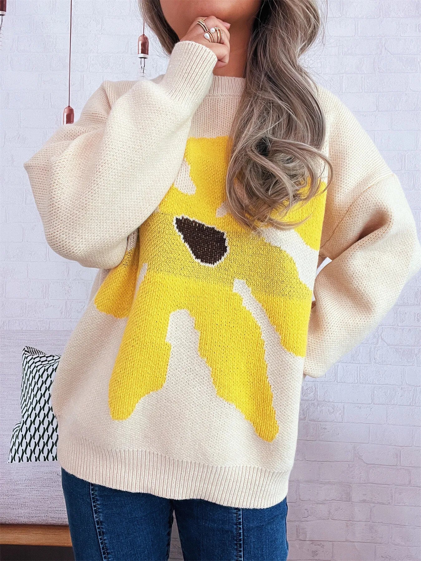 Apricot oversized sweater with trippy daisy flower design – Wavy Daisy style from A Whimsical Affair.