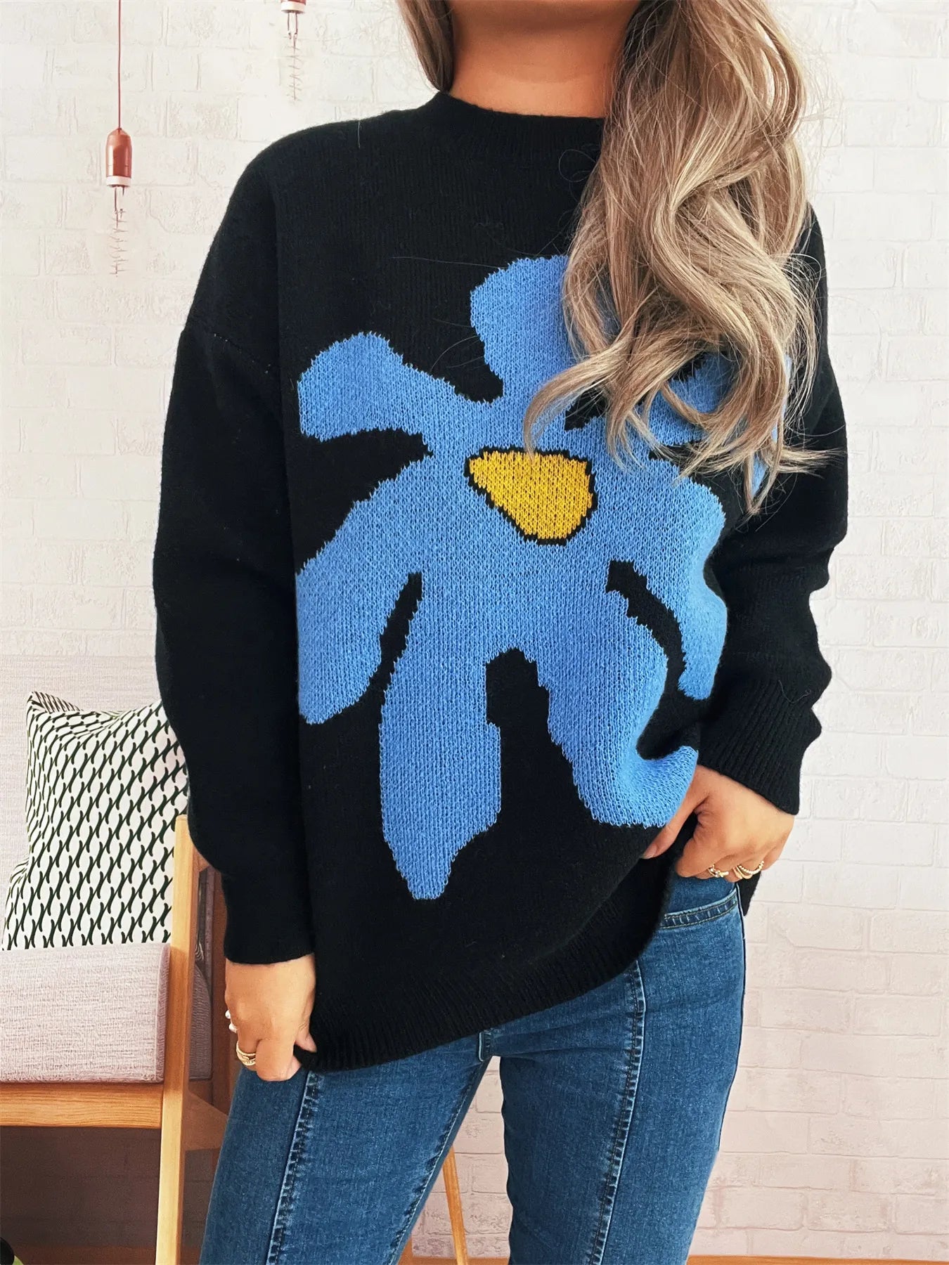 Black oversized sweater with trippy daisy flower design – Wavy Daisy style from A Whimsical Affair.