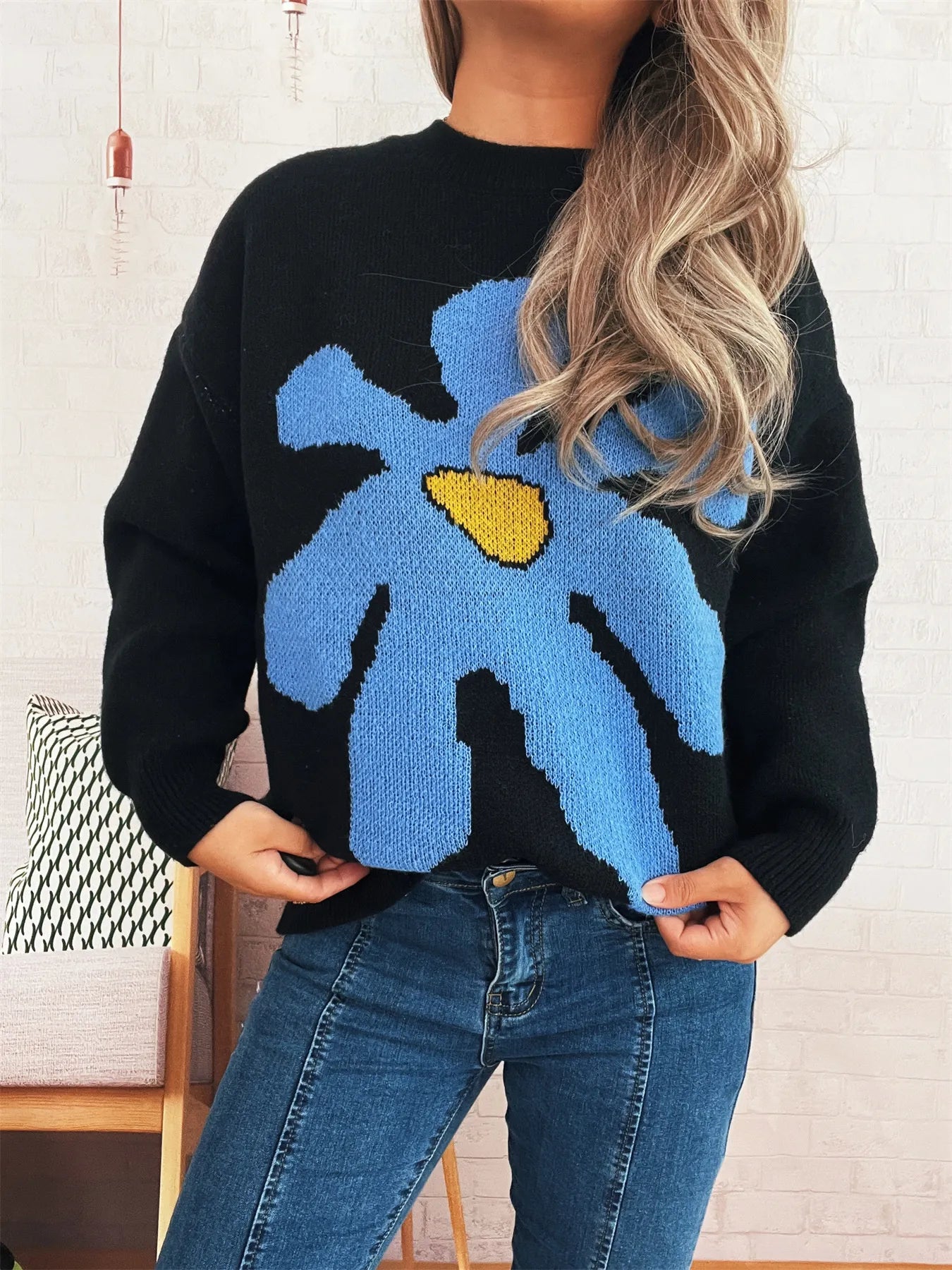 Black oversized sweater with trippy daisy flower design – Wavy Daisy style from A Whimsical Affair.