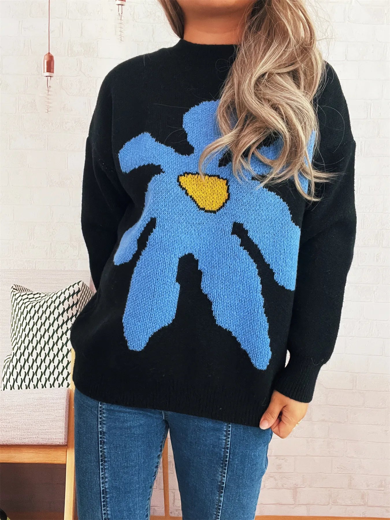 Black oversized sweater with trippy daisy flower design – Wavy Daisy style from A Whimsical Affair.
