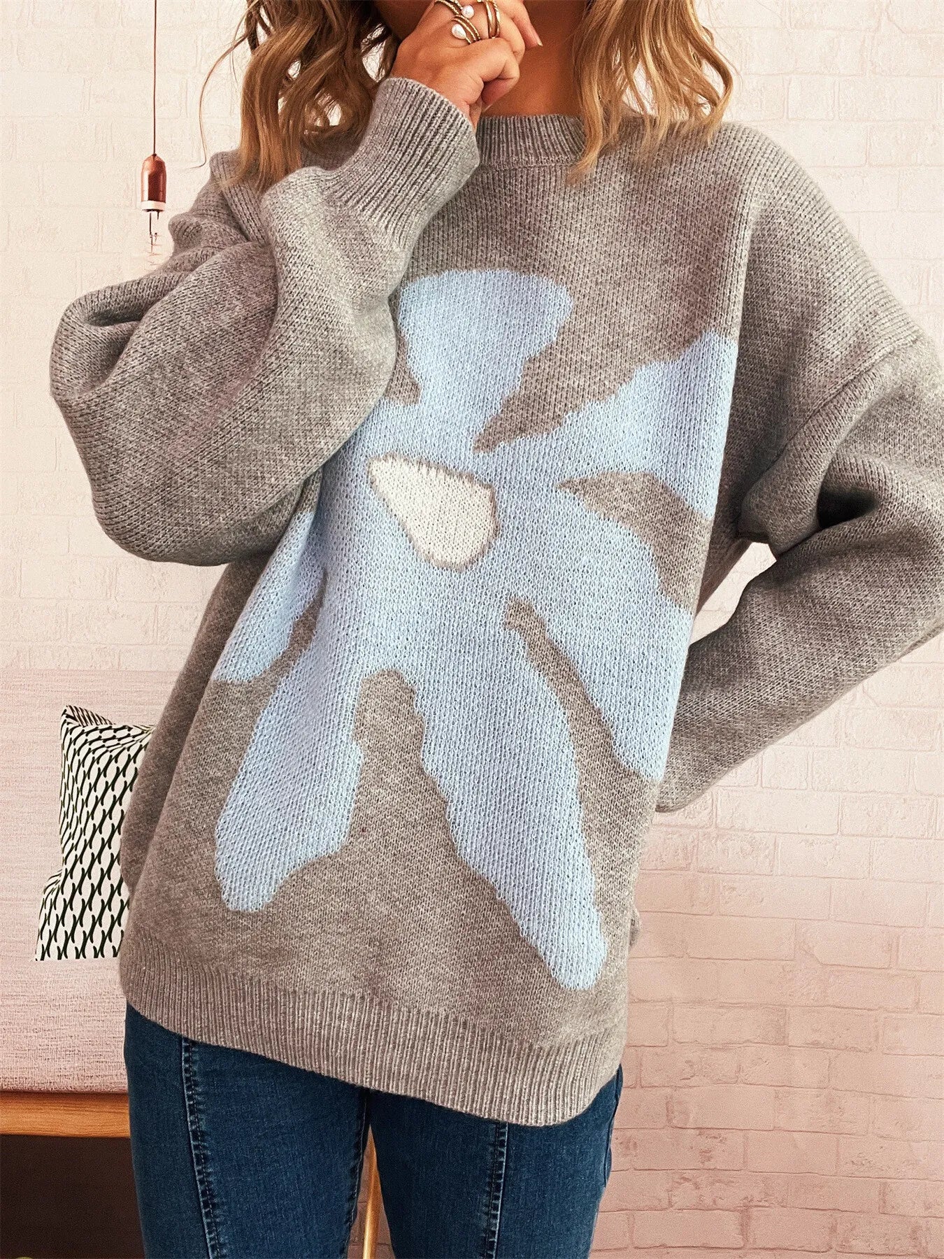Gray oversized sweater with trippy daisy flower design – Wavy Daisy style from A Whimsical Affair.