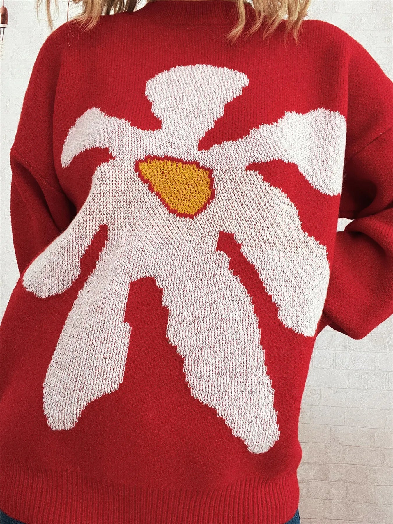 Red oversized sweater with trippy daisy flower design – Wavy Daisy style from A Whimsical Affair.