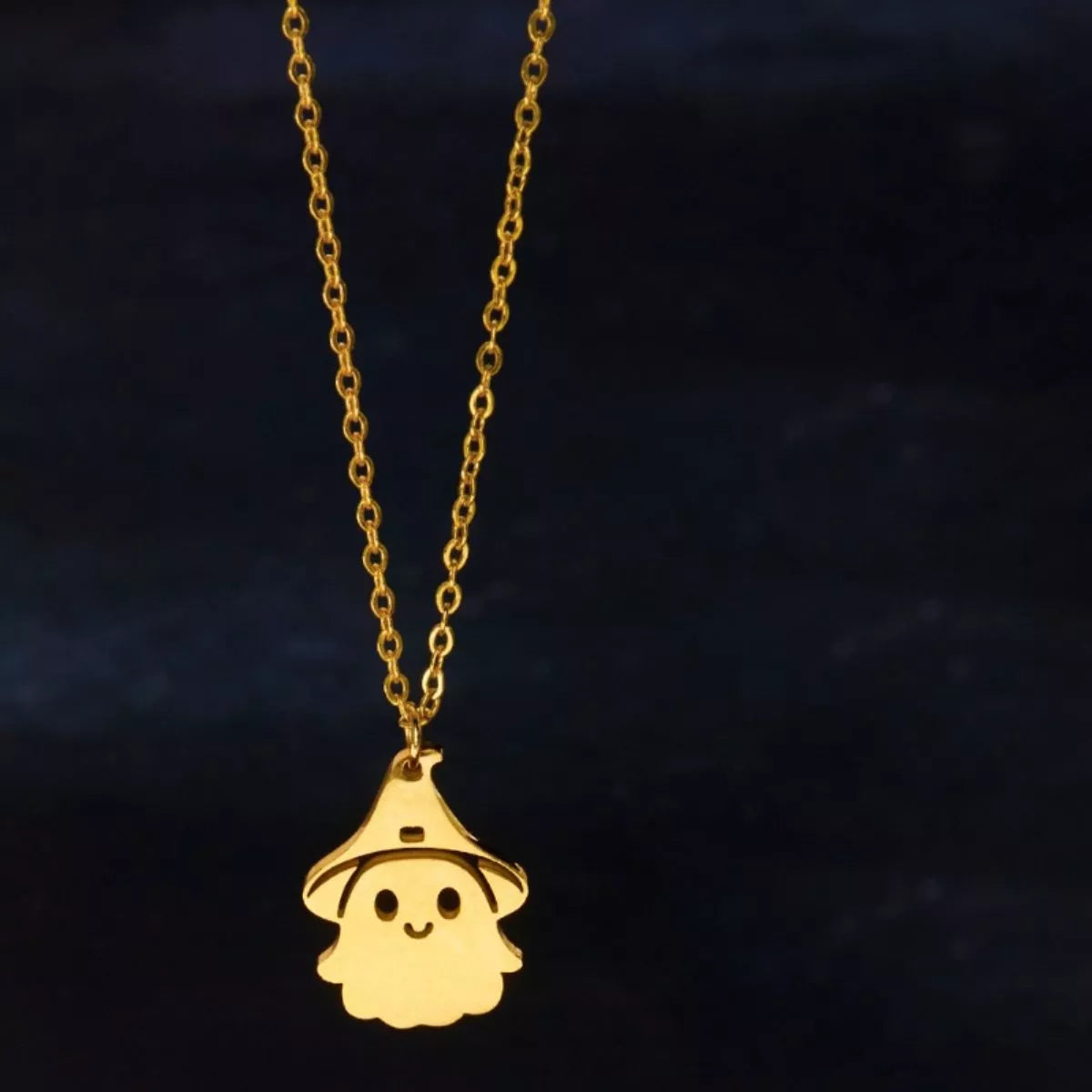 Whimsical Spirit Ghost Necklace – 18K gold-plated pendant with smiling ghost in a witch hat.
