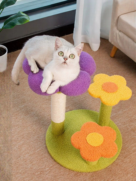 White cat lounging on colorful flower-shaped cat perch with scratching post