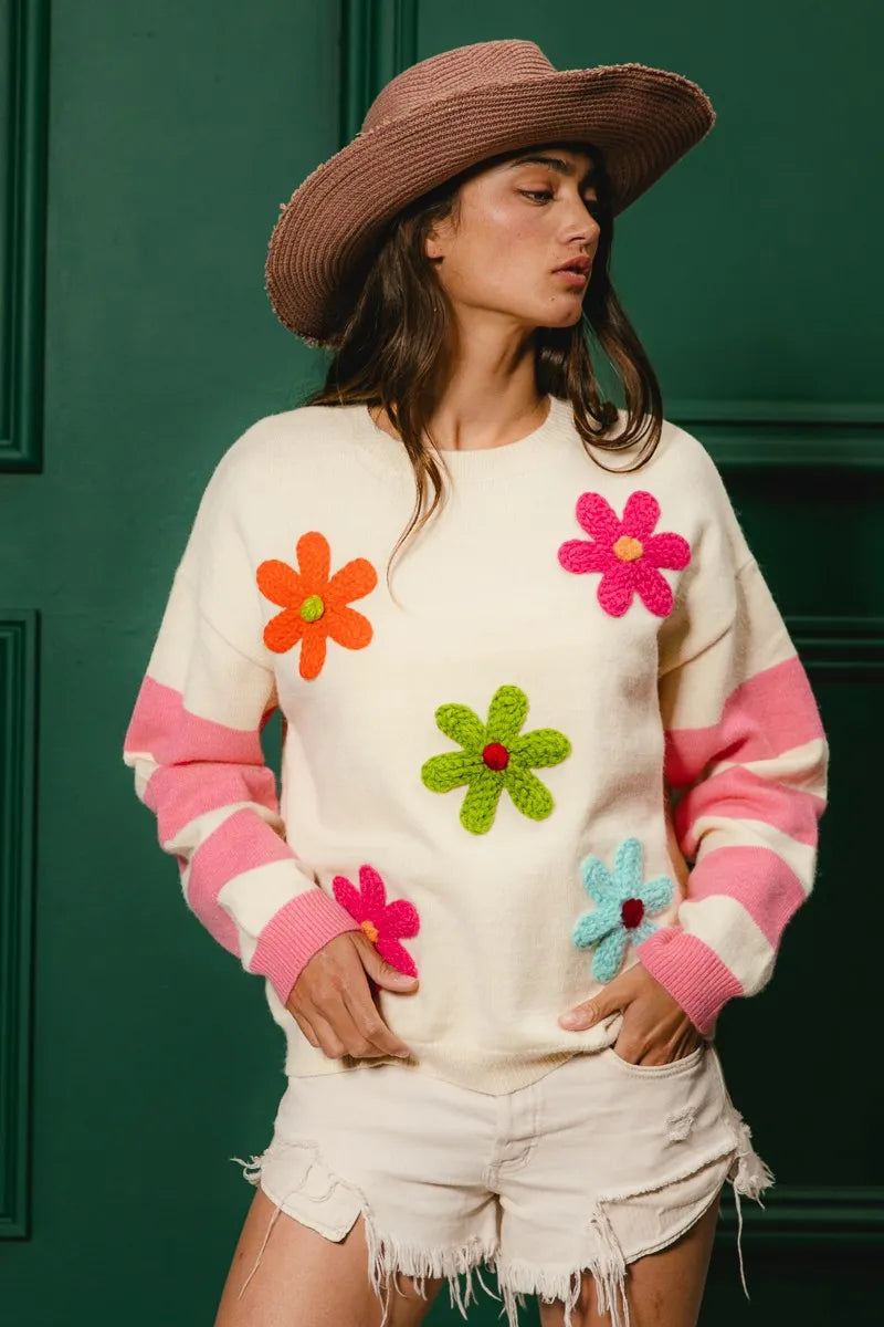 Whimsy Bloom Sweater by BiBi – oatmeal knit with colorful floral appliqués and striped sleeves.