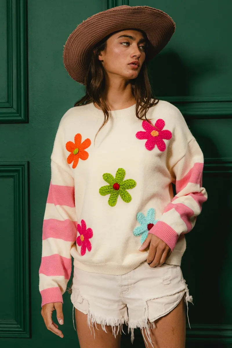 Whimsy Bloom Sweater by BiBi – oatmeal knit with colorful floral appliqués and striped sleeves.