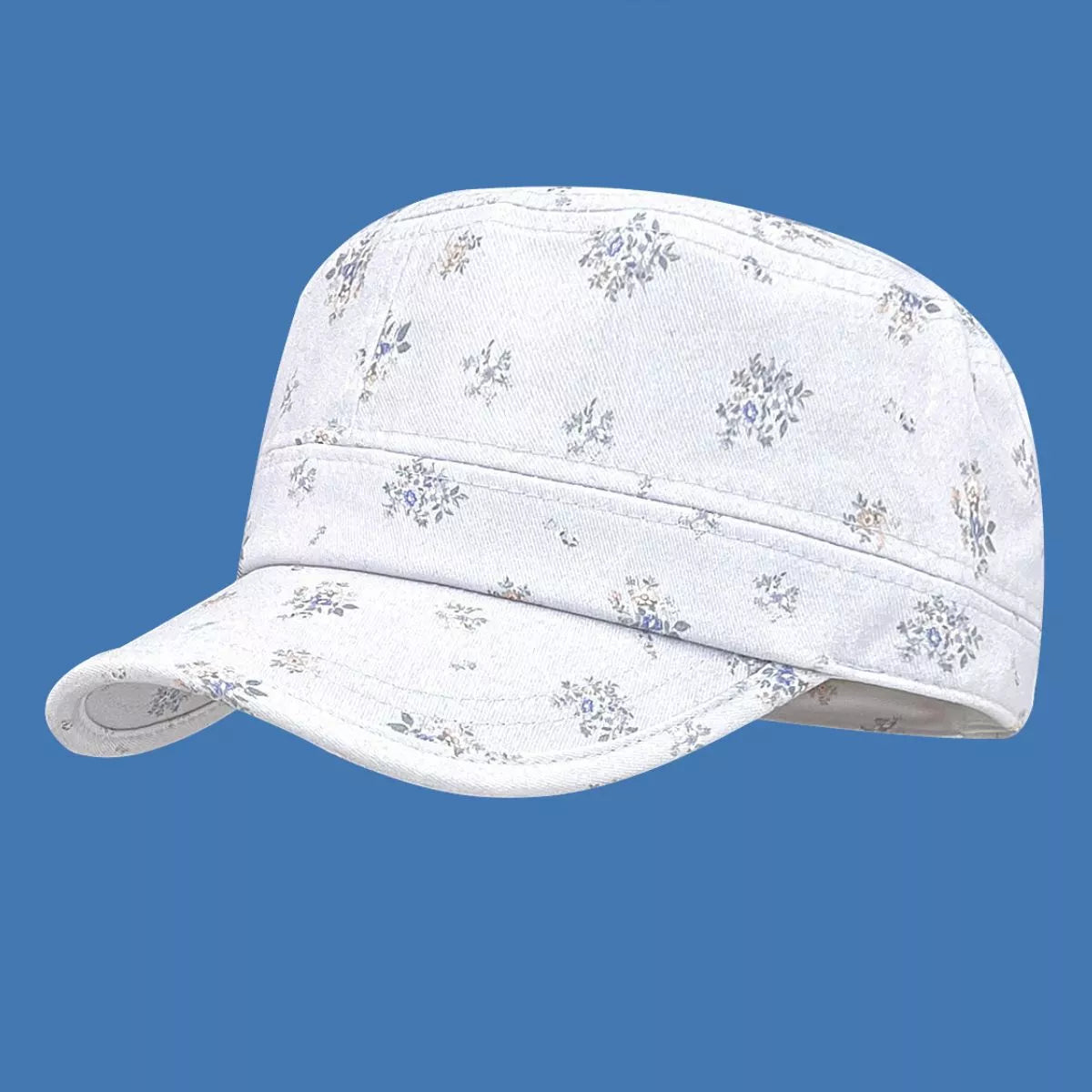 Cream cotton cadet cap with tiny floral print, structured brim, and soft vintage-inspired casual style.