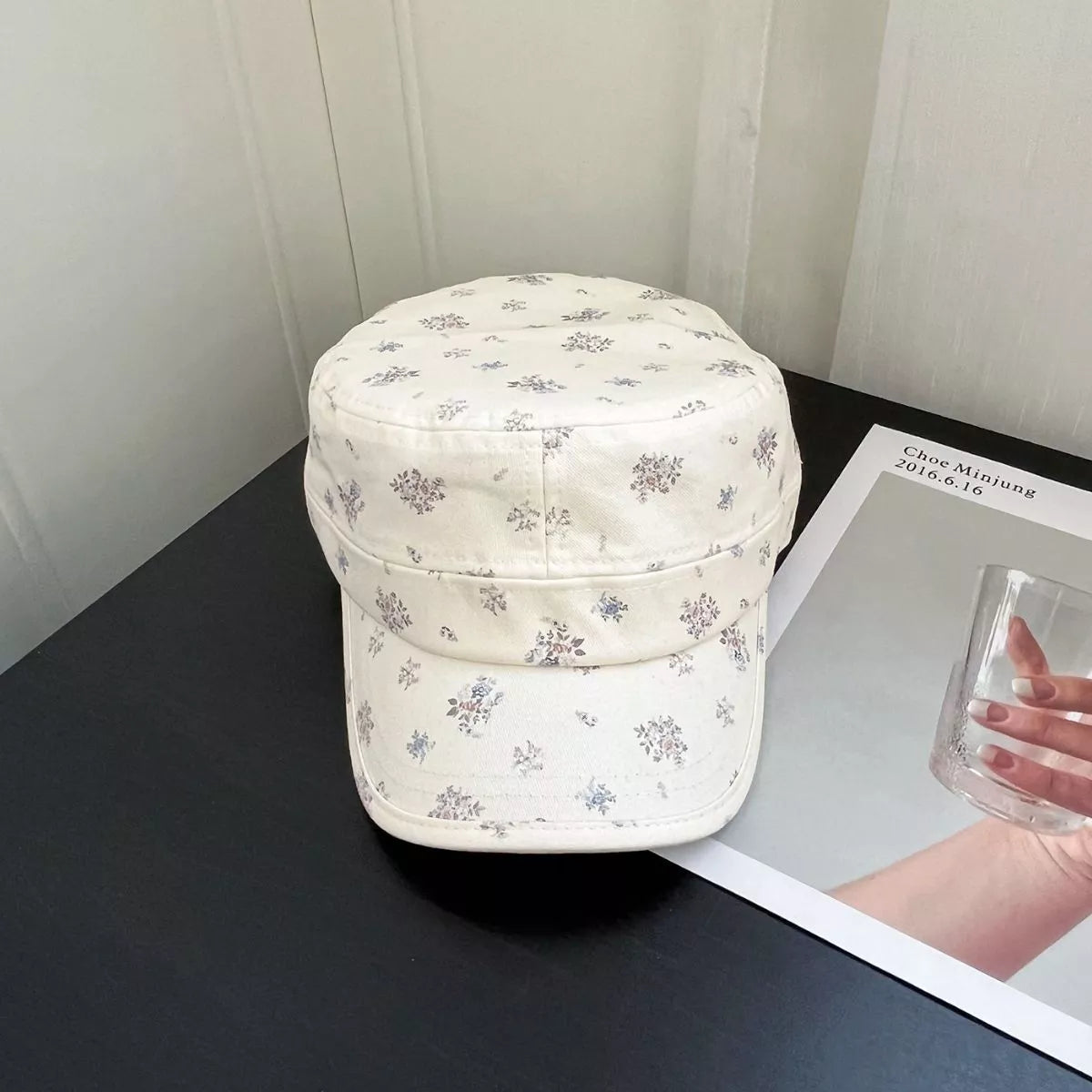 Cream cotton cadet cap with tiny floral print, structured brim, and soft vintage-inspired casual style.