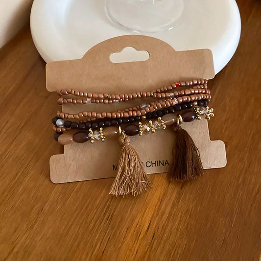 Alt Text: Coffee brown rice bead bracelet with tassel accent – Whisper style from A Whimsical Affair.