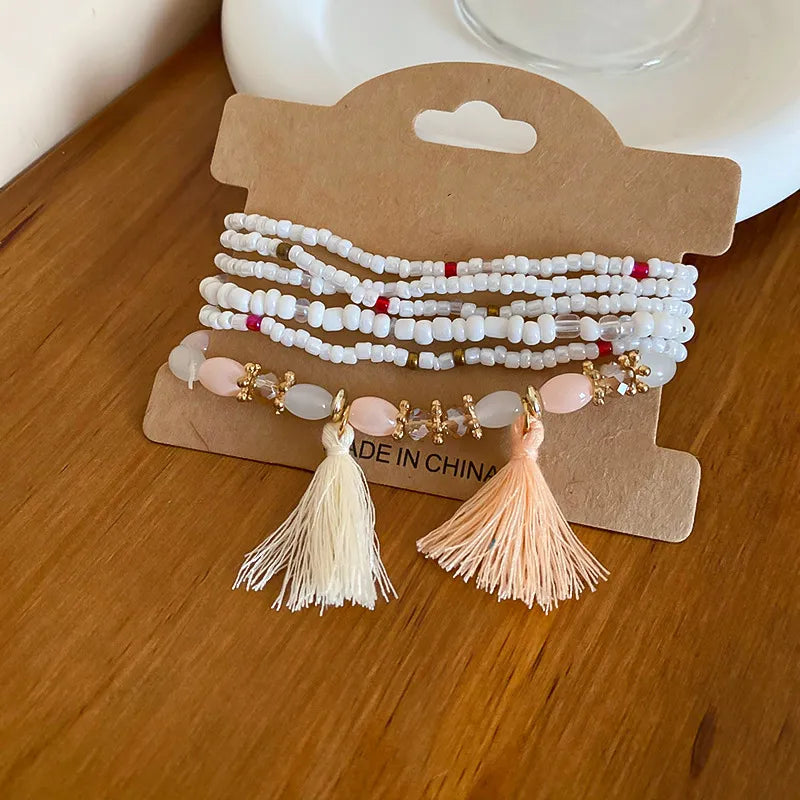White rice bead bracelet with tassel accent – Whisper style from A Whimsical Affair.