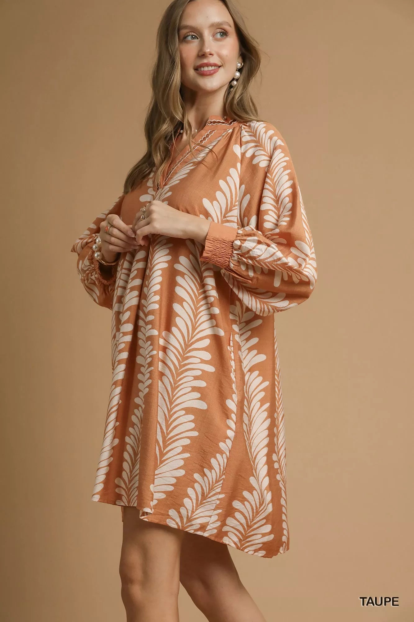 Whispering Leaves Taupe Mini Babydoll Dress with leaf print, notched neckline, and relaxed silhouette.