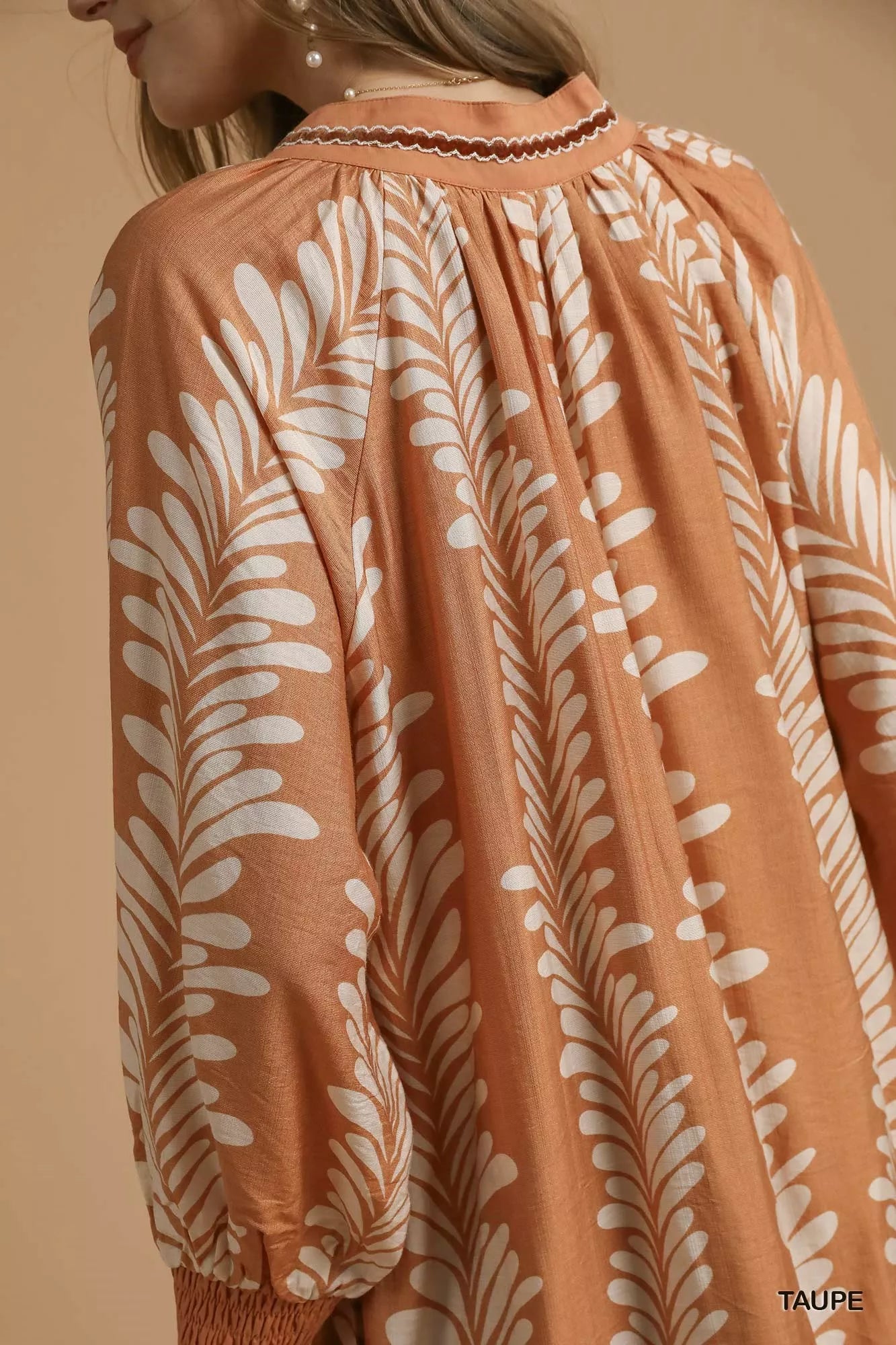 Whispering Leaves Taupe Mini Babydoll Dress with leaf print, notched neckline, and relaxed silhouette.