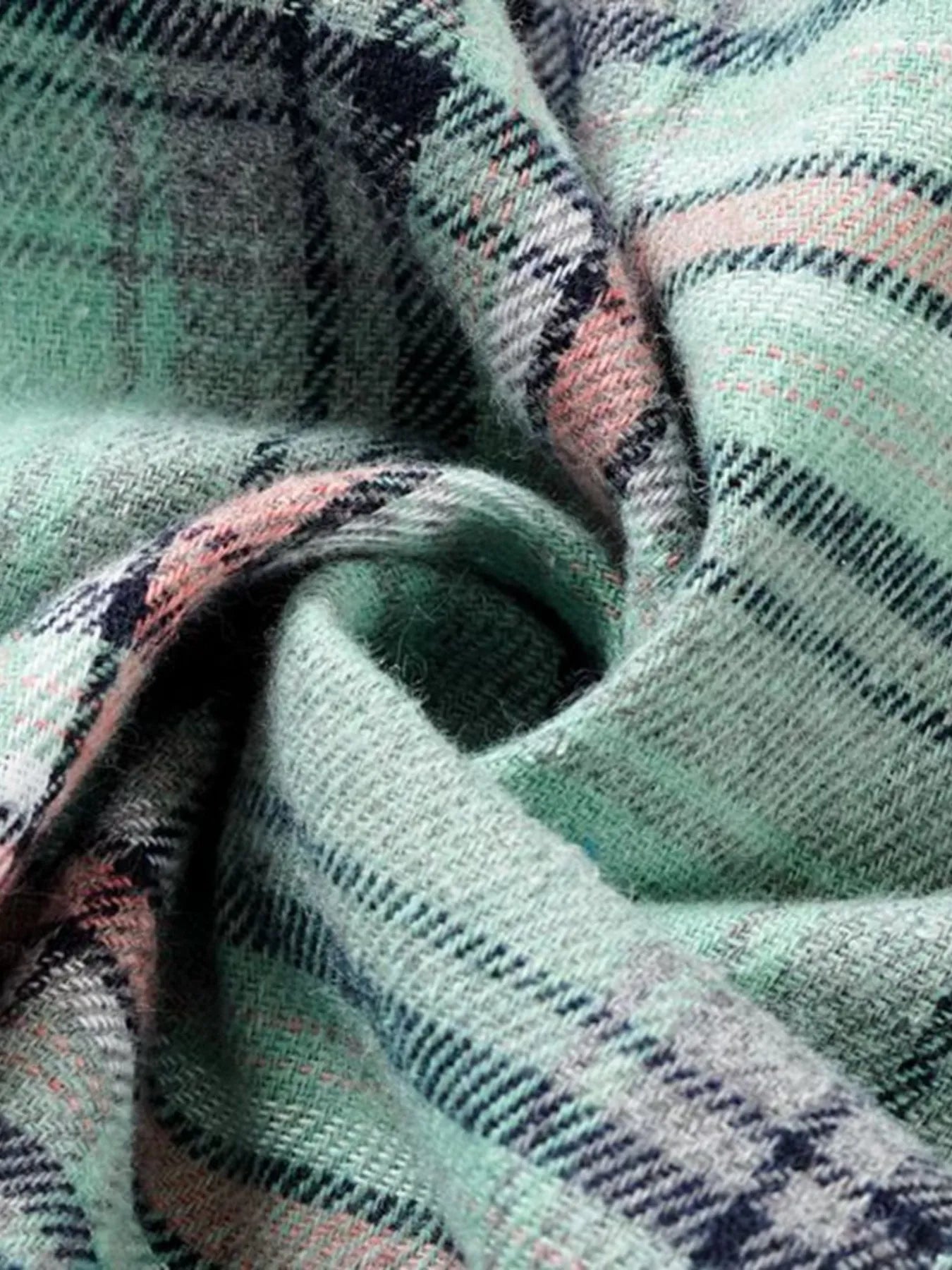 A green plaid flannel hoodie shirt with buttoned front and relaxed fit, perfect for cozy fall layering.