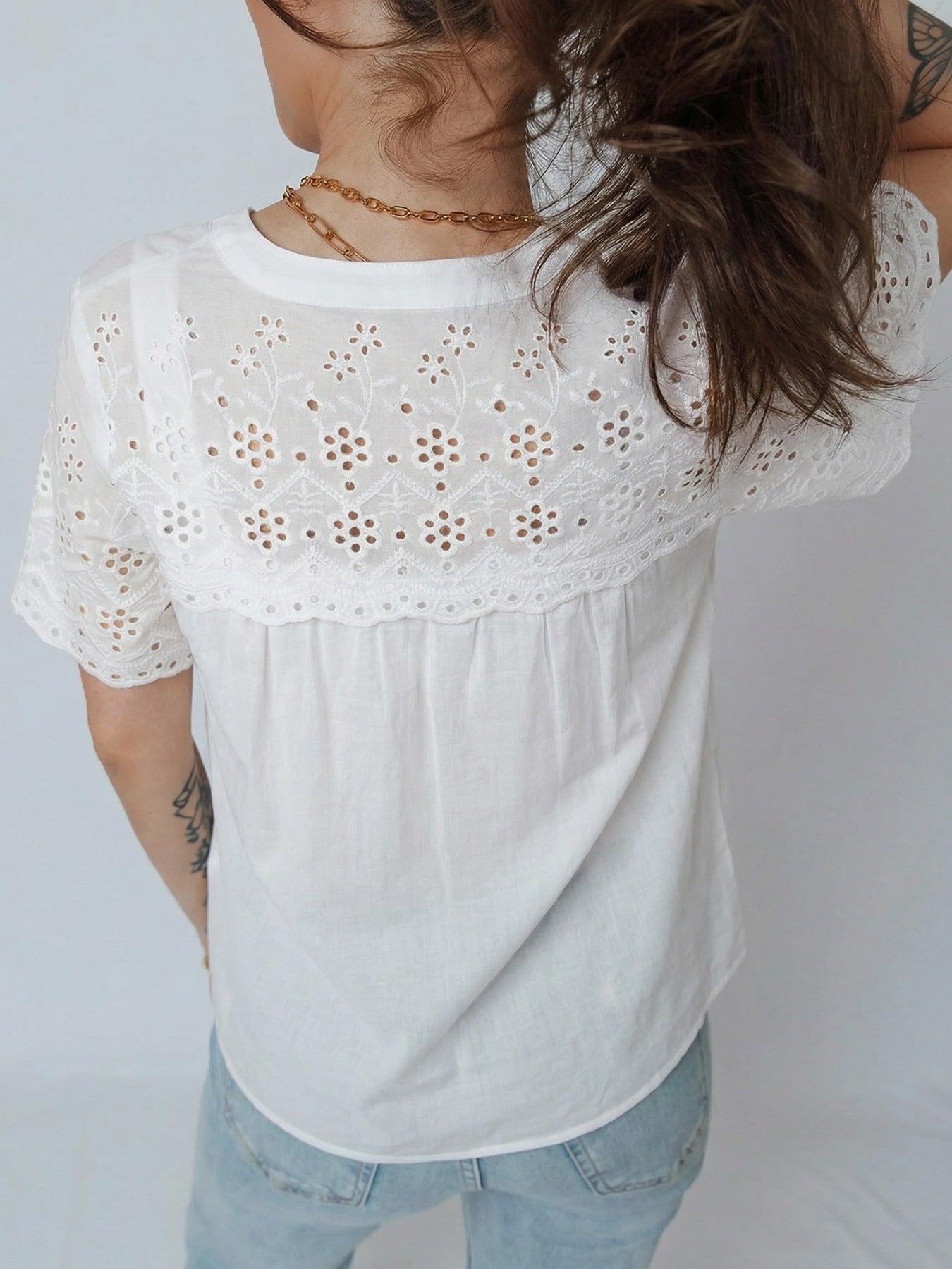 White cotton blouse with eyelet embroidery and button front