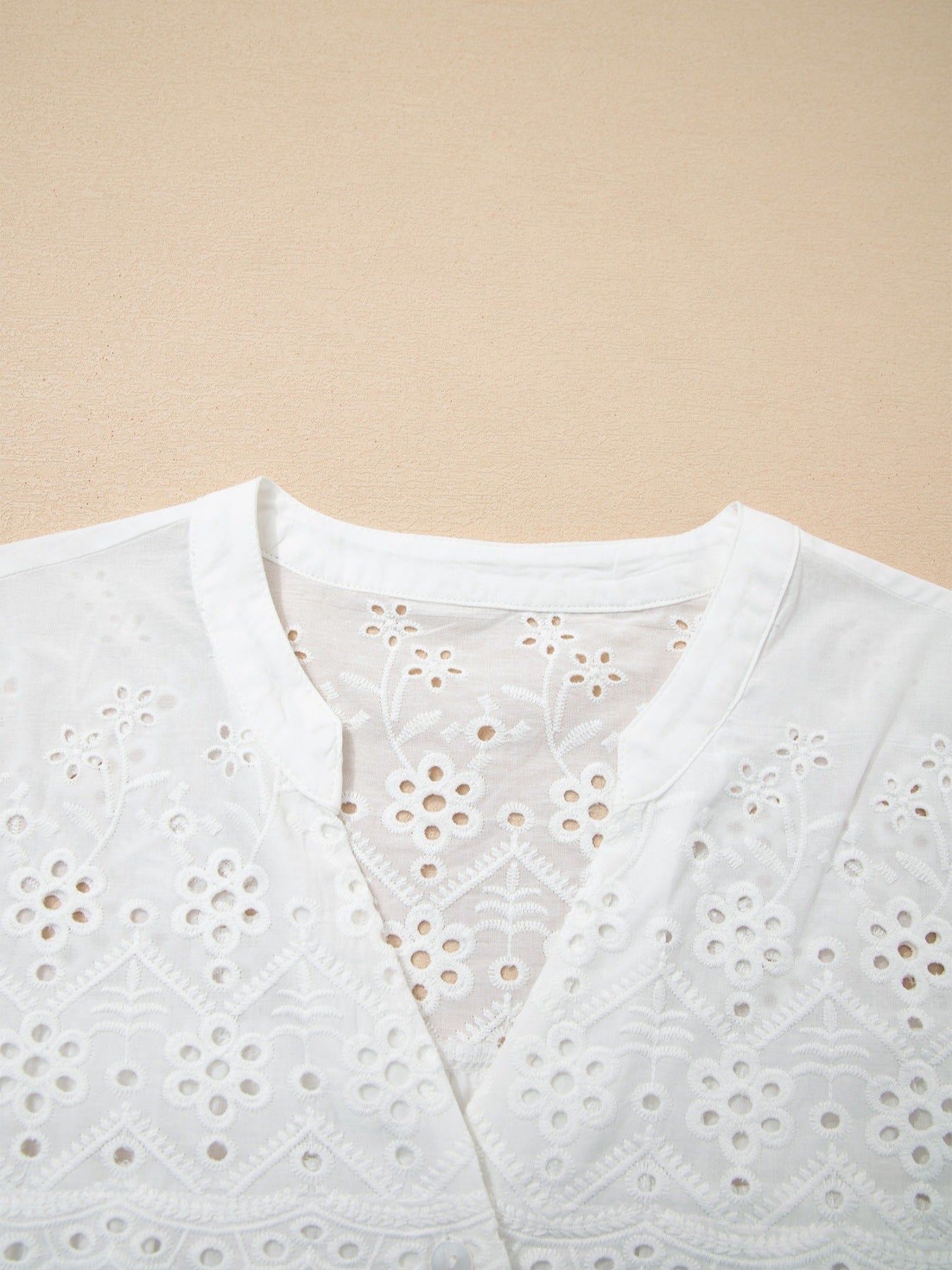 White cotton blouse with eyelet embroidery and button front