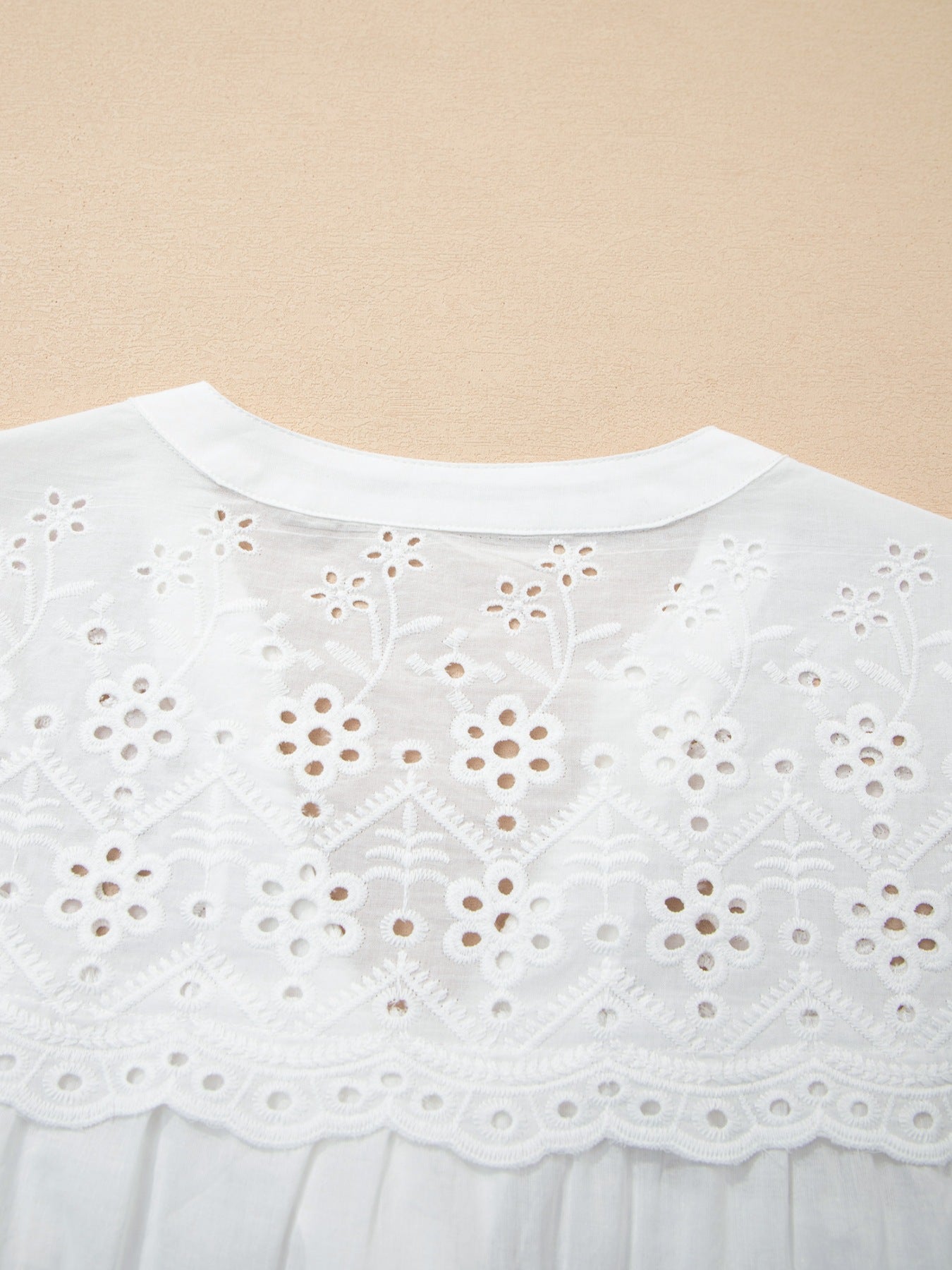 White cotton blouse with eyelet embroidery and button front