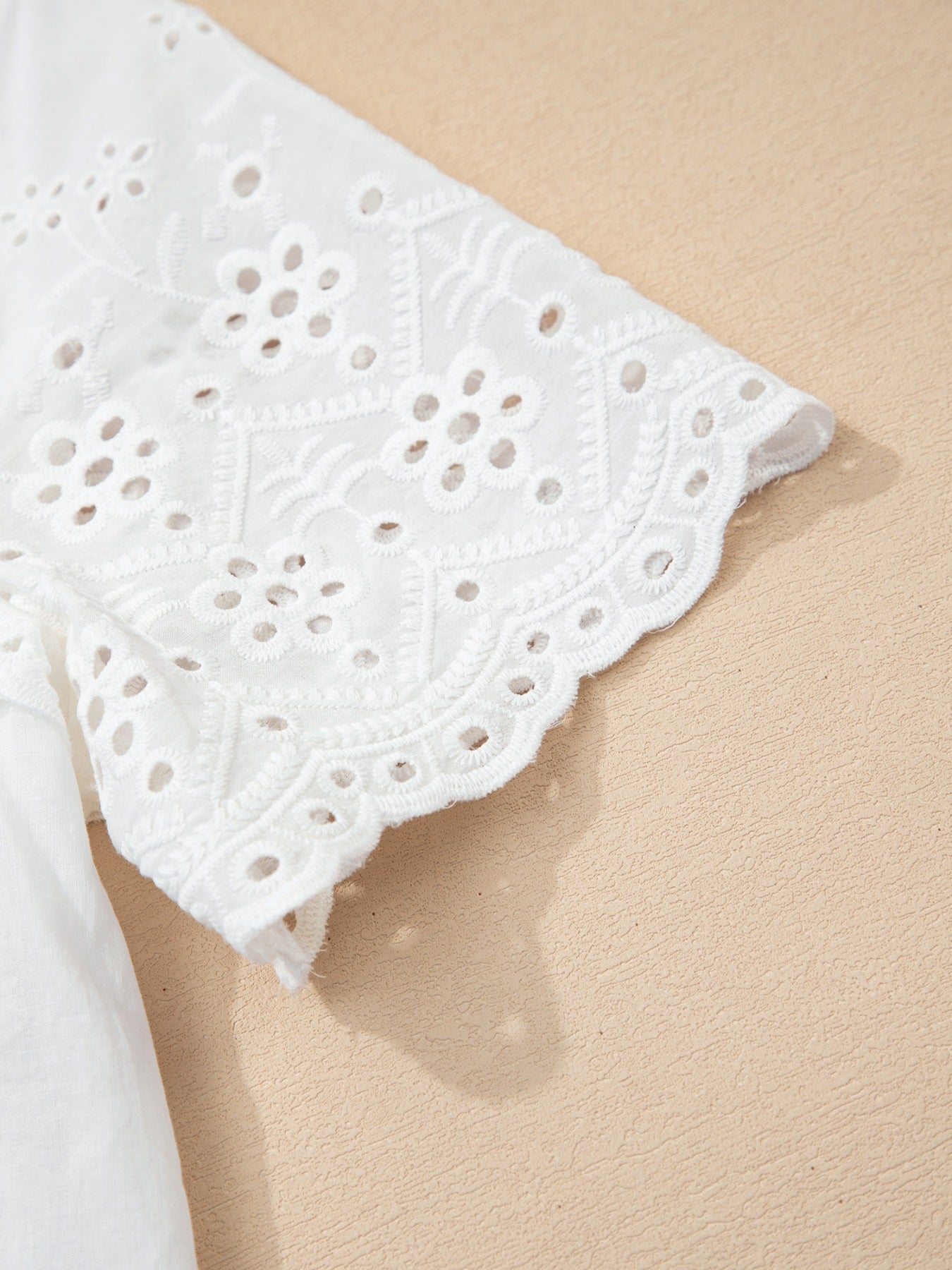 White cotton blouse with eyelet embroidery and button front