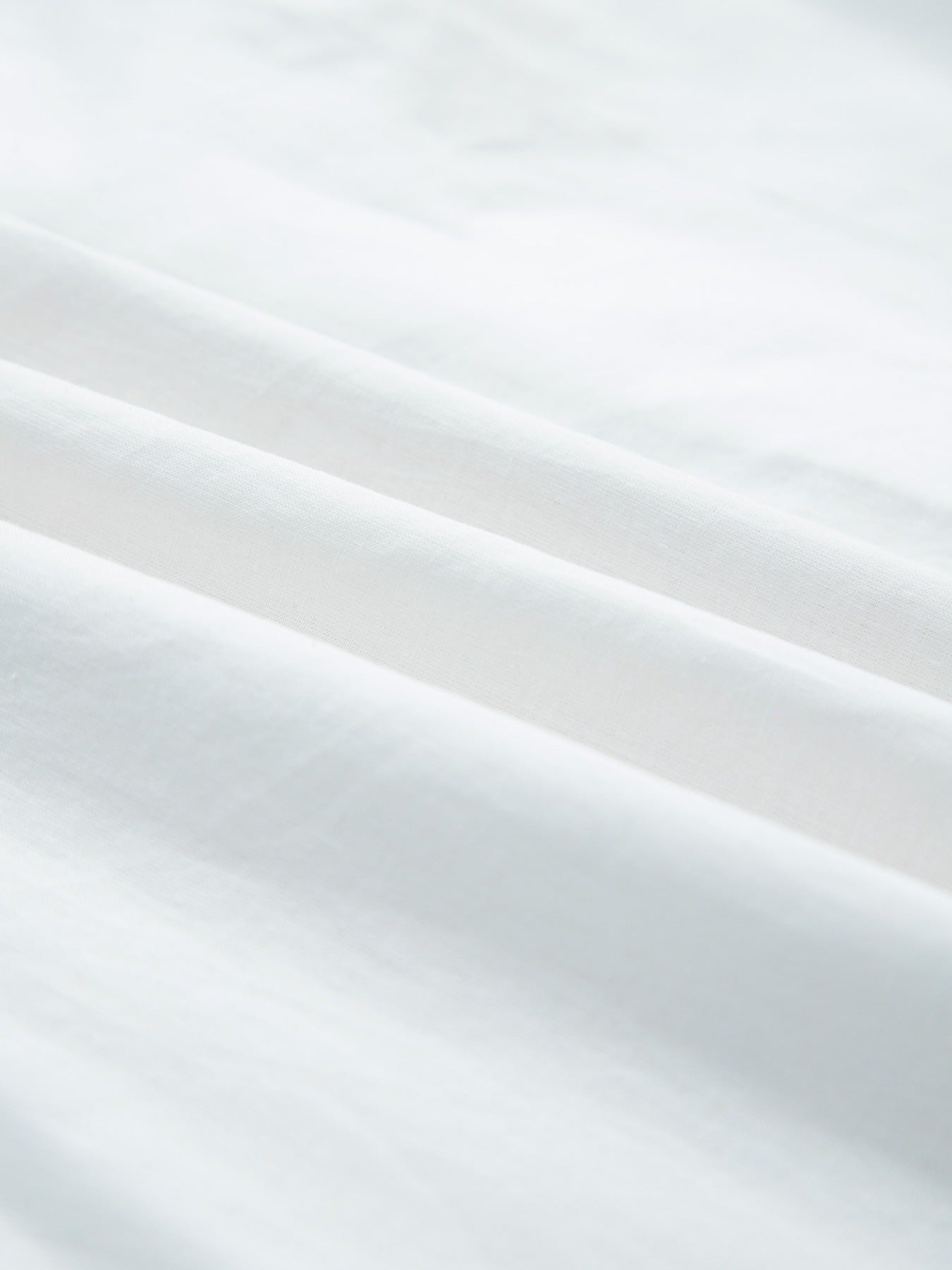 White cotton blouse with eyelet embroidery and button front