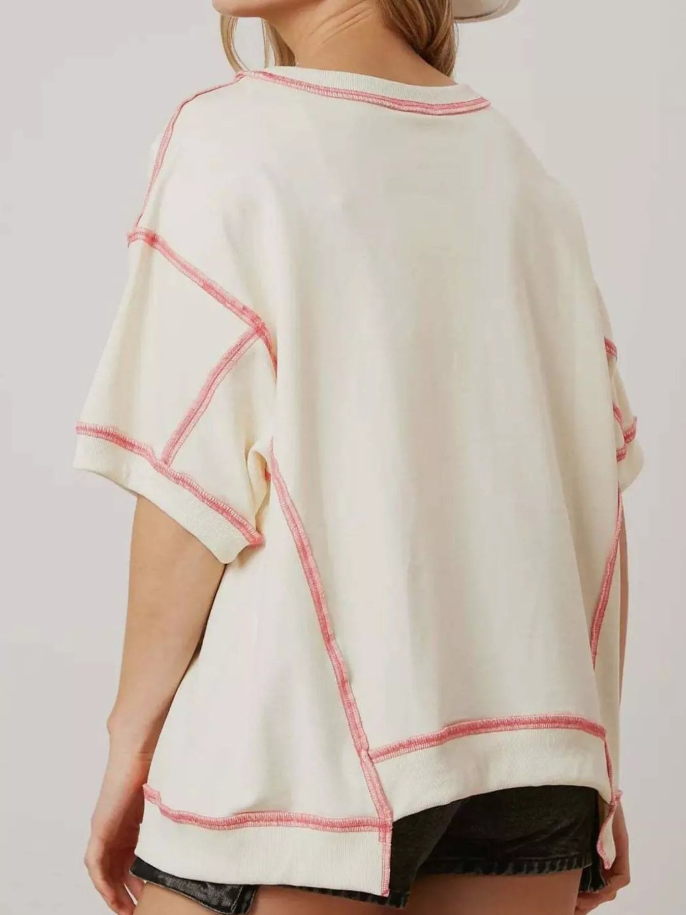 Oversized white tee with pink glitter lobster print and contrast stitching.