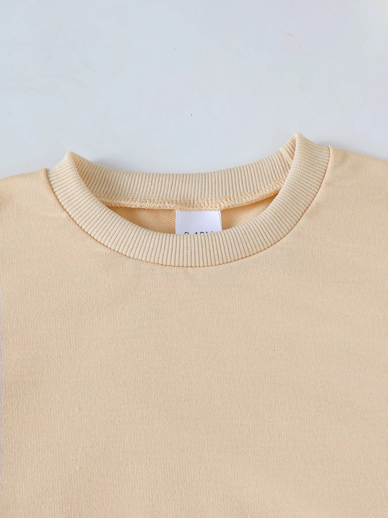 toddler halloween outfit with wicked cute pumpkin ghost sweatshirt and brown ribbed bell-bottom pants two-piece set