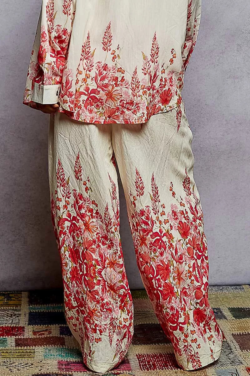 Floral printed wide leg pants with drawstring waist in red and cream tones, styled for a boho chic look.