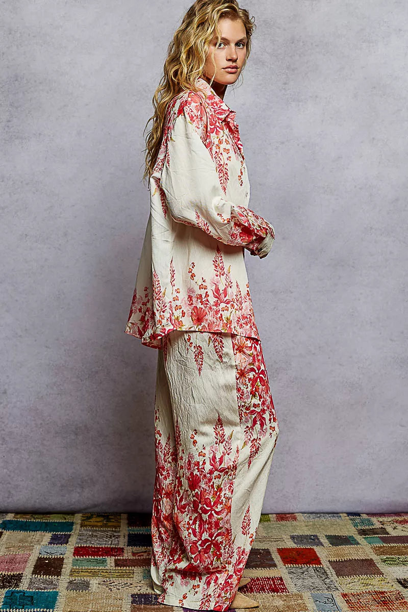 Floral printed wide leg pants with drawstring waist in red and cream tones, styled for a boho chic look.