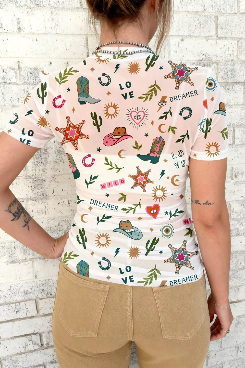 Sheer mesh western print top with cowgirl boots and cactus pattern