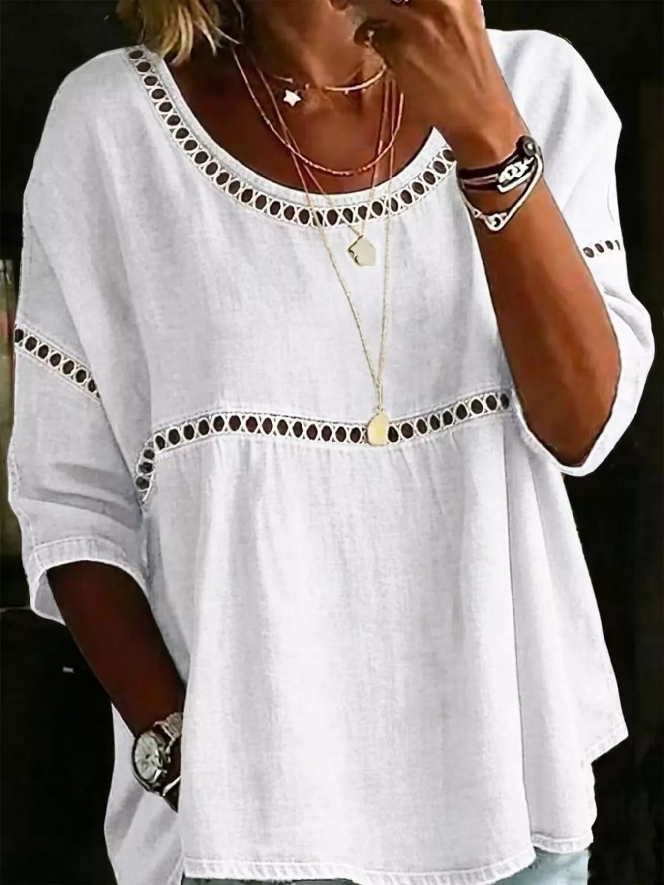Flowy boho blouse with lace detail, relaxed fit, three-quarter sleeves, lightweight woven fabric, and vintage-inspired styling.
