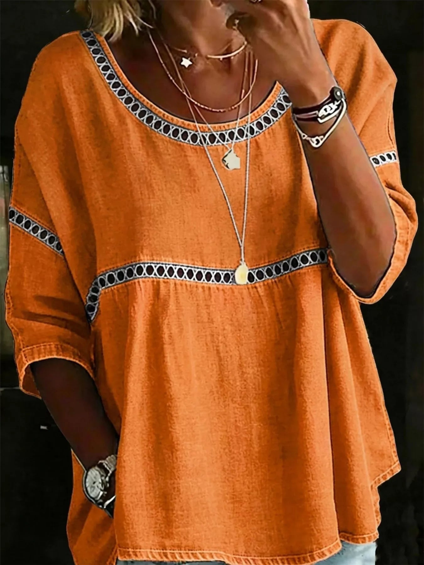 Flowy boho blouse with lace detail, relaxed fit, three-quarter sleeves, lightweight woven fabric, and vintage-inspired styling.