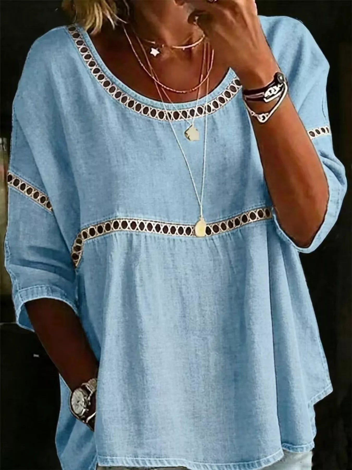 Flowy boho blouse with lace detail, relaxed fit, three-quarter sleeves, lightweight woven fabric, and vintage-inspired styling.