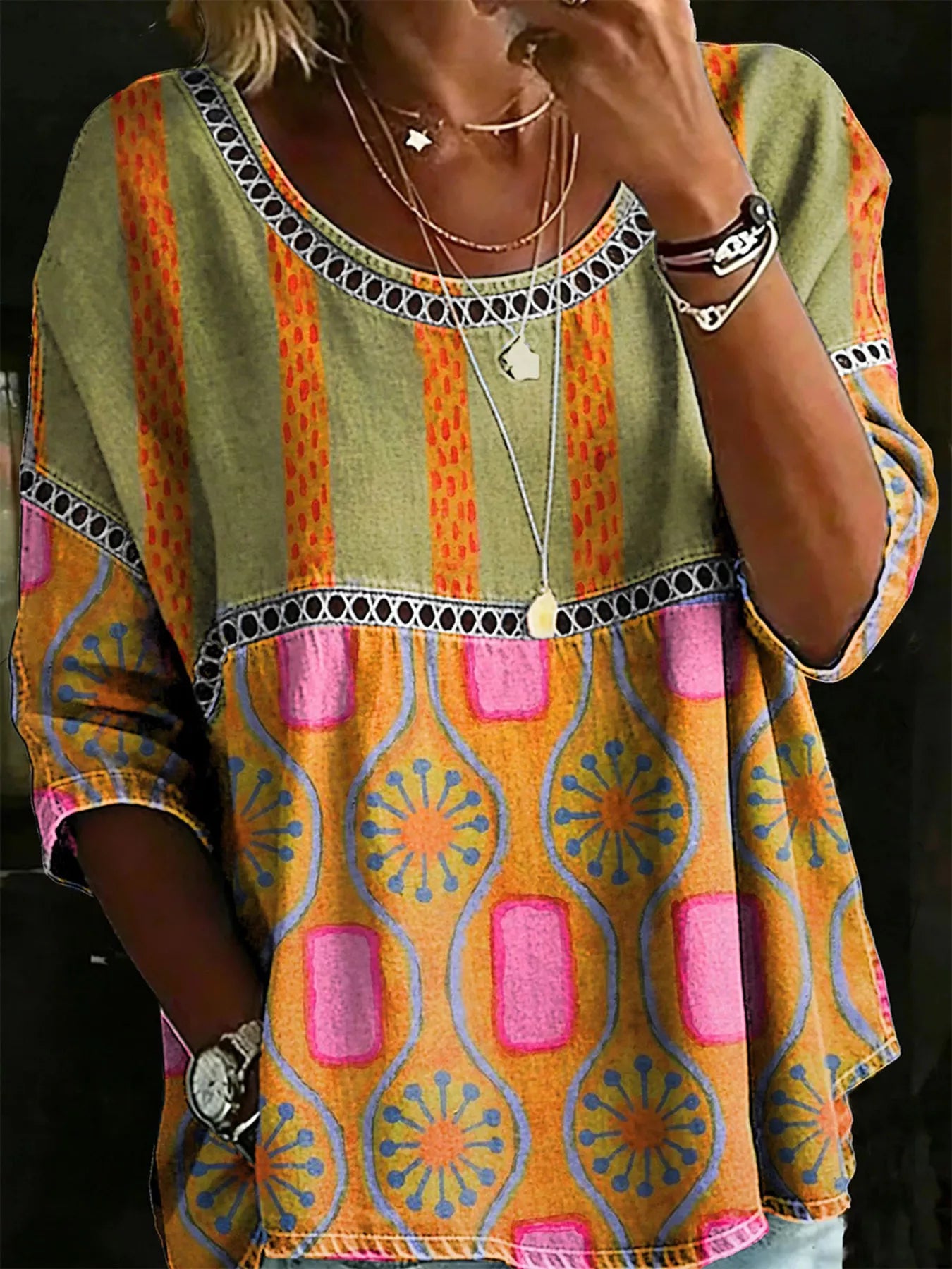 Flowy boho blouse with lace detail, relaxed fit, three-quarter sleeves, lightweight woven fabric, and vintage-inspired styling.