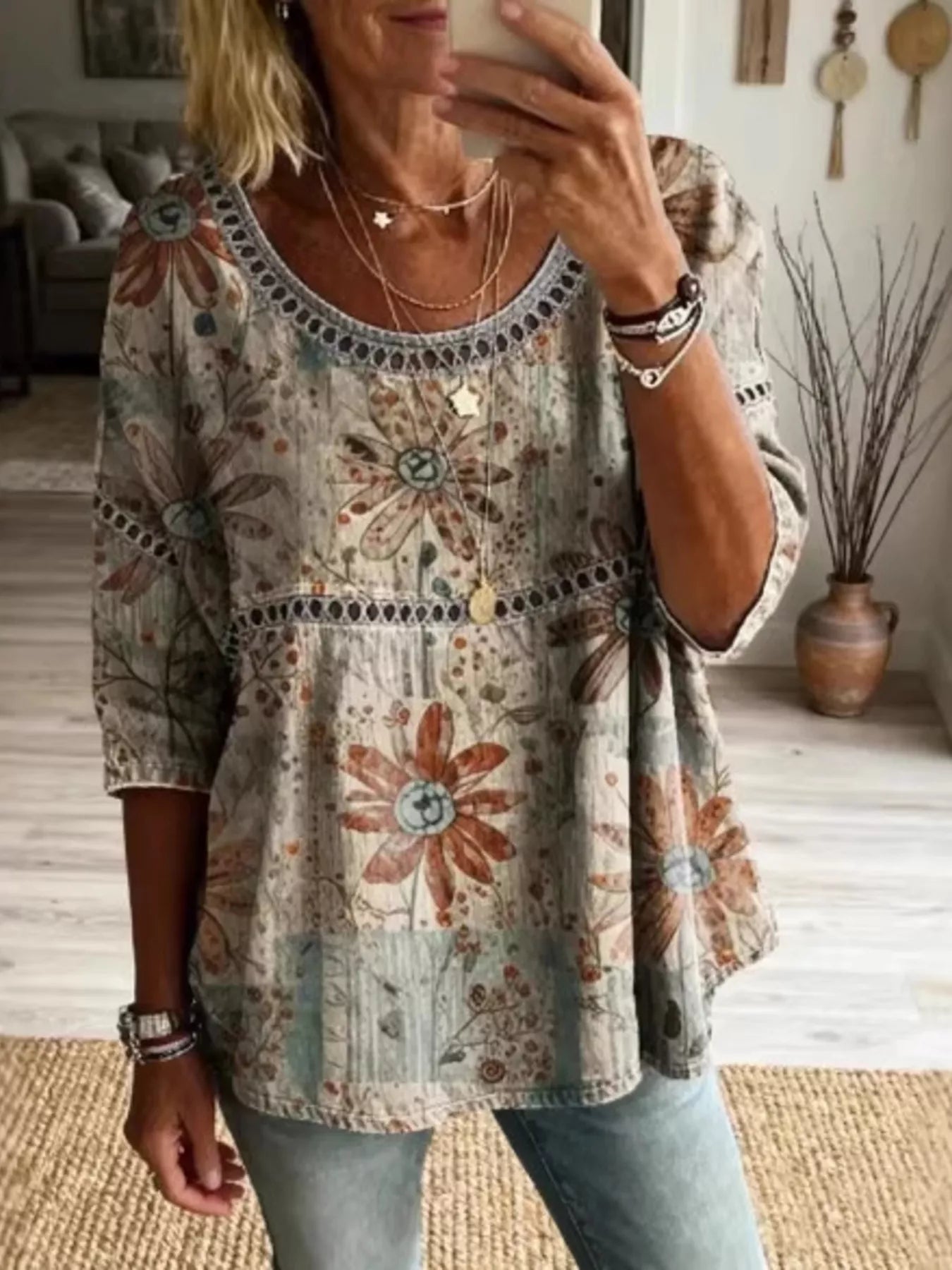 Flowy boho blouse with lace detail, relaxed fit, three-quarter sleeves, lightweight woven fabric, and vintage-inspired styling.
