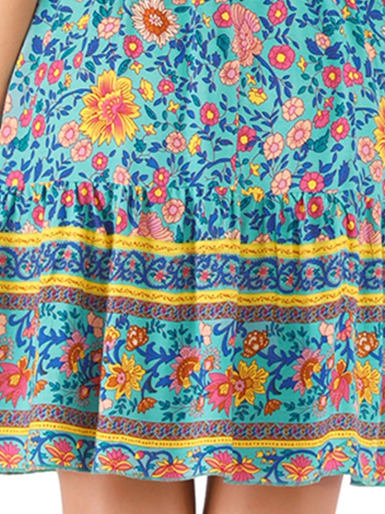 colorful turquoise floral boho sundress with lace-up neckline and flowy summer silhouette