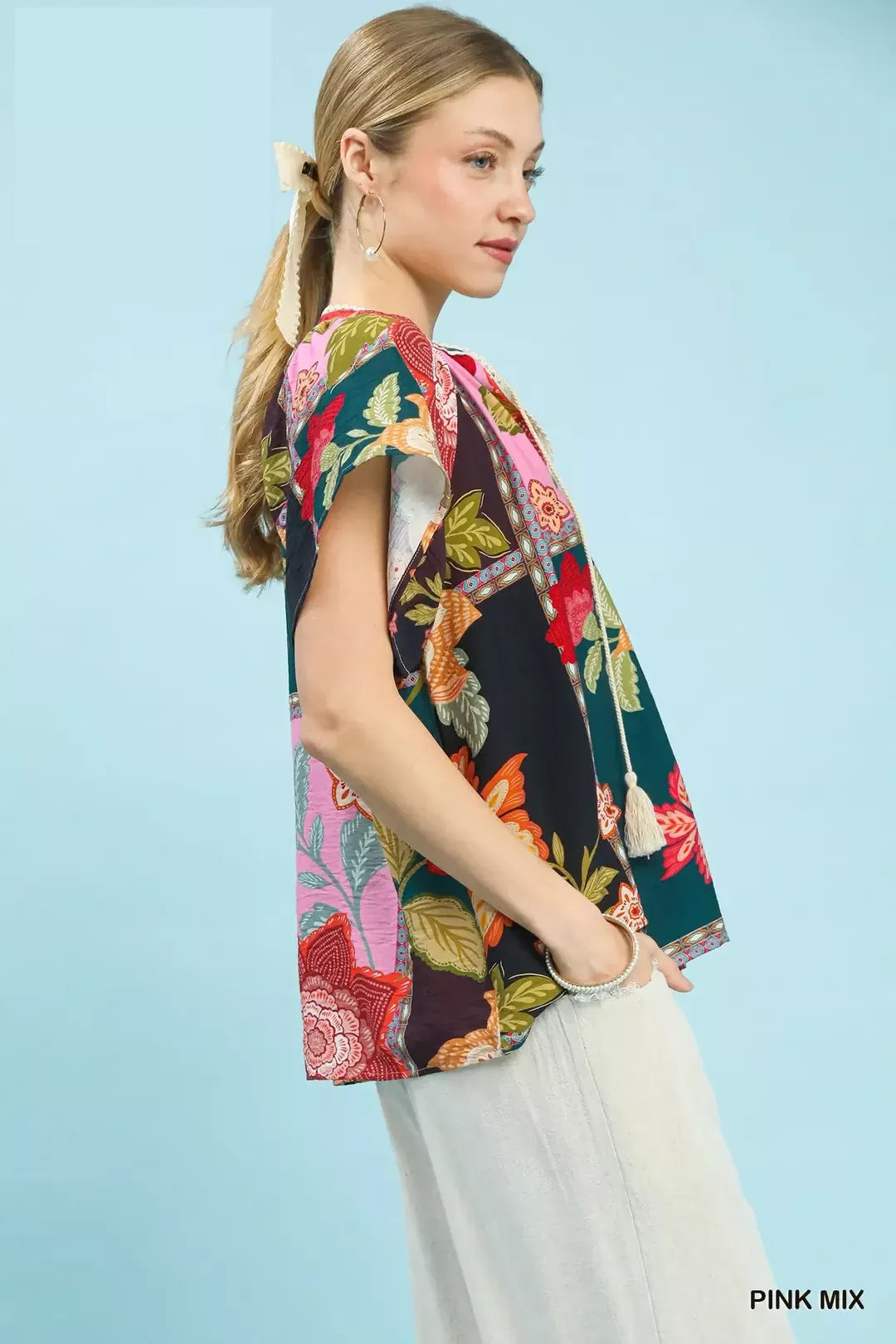 lightweight boho patchwork blouse with tassel tie neckline and floral-inspired print details