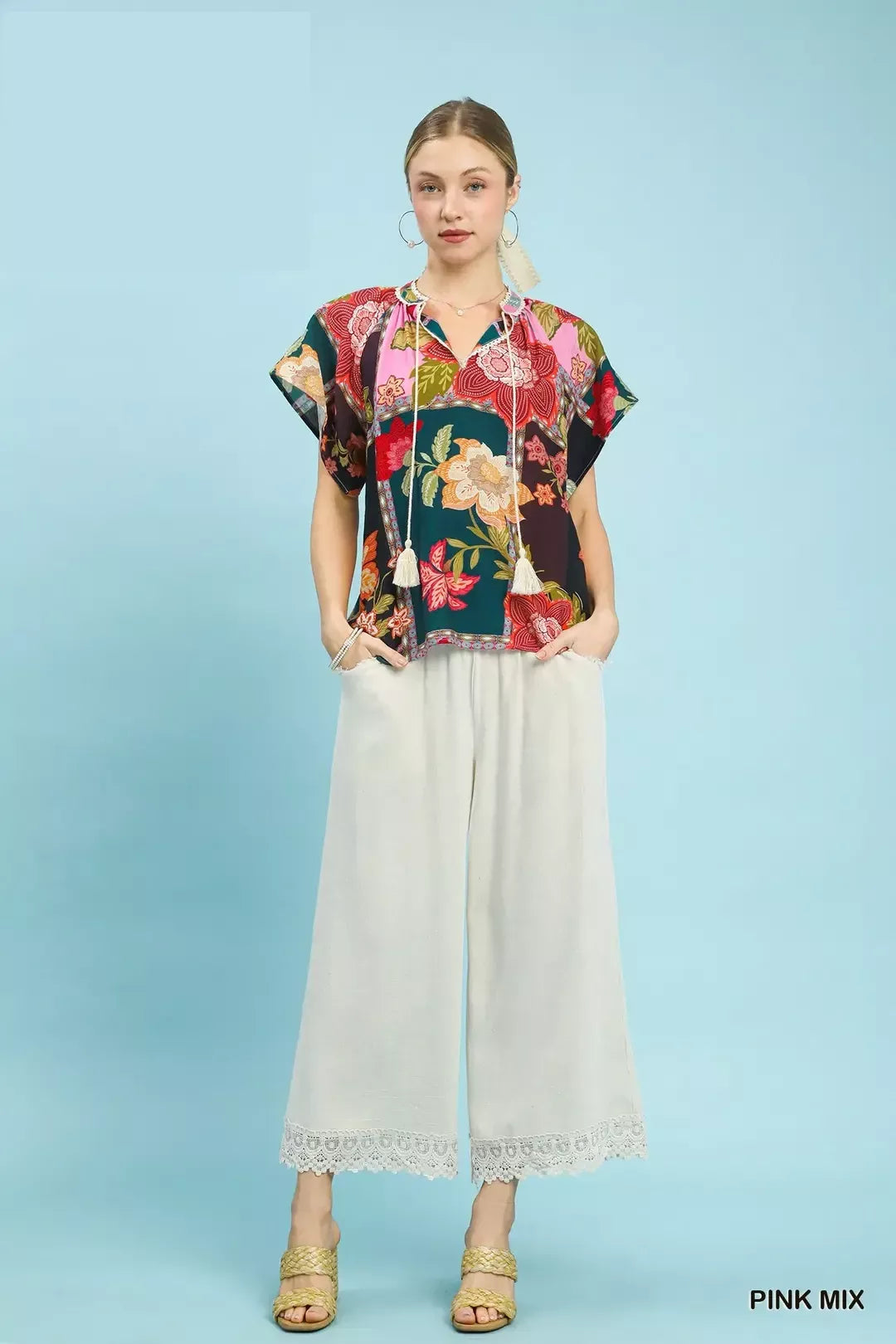lightweight boho patchwork blouse with tassel tie neckline and floral-inspired print details