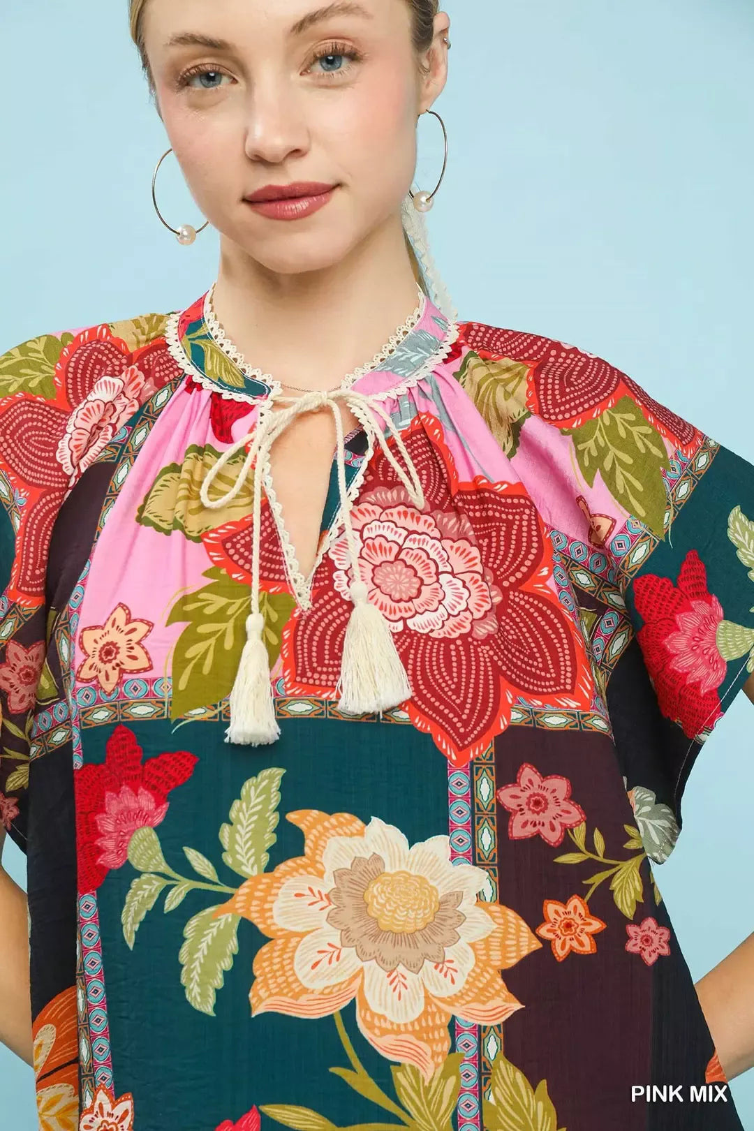 lightweight boho patchwork blouse with tassel tie neckline and floral-inspired print details
