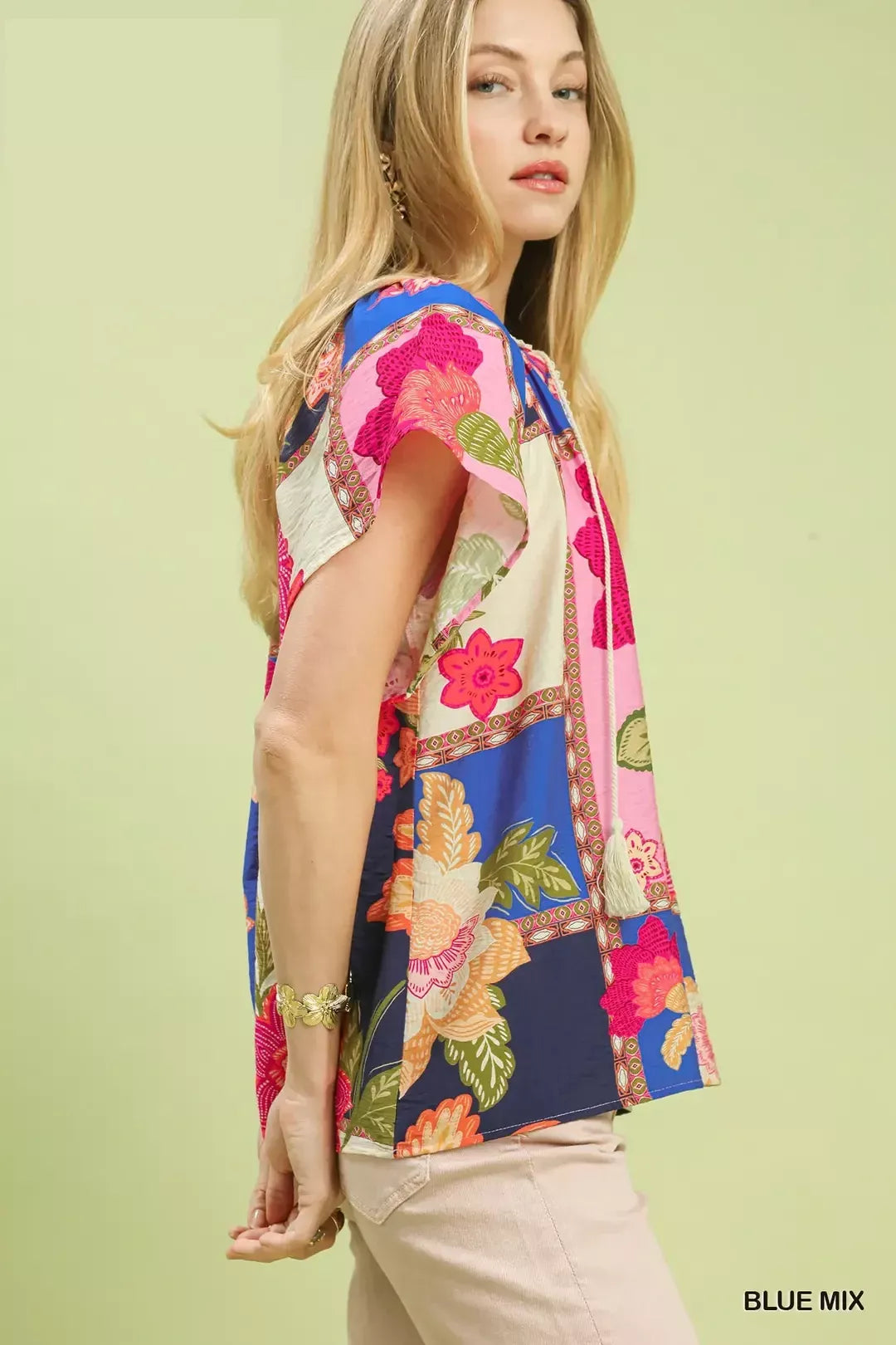 lightweight boho patchwork blouse with tassel tie neckline and floral-inspired print details