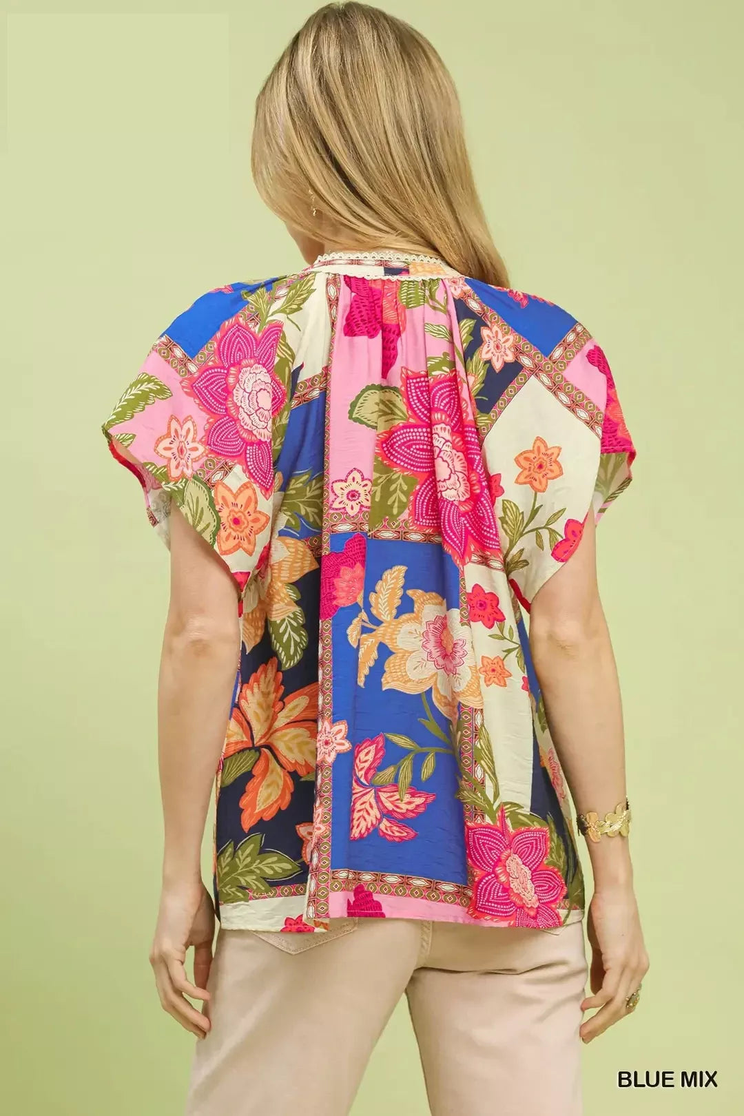lightweight boho patchwork blouse with tassel tie neckline and floral-inspired print details