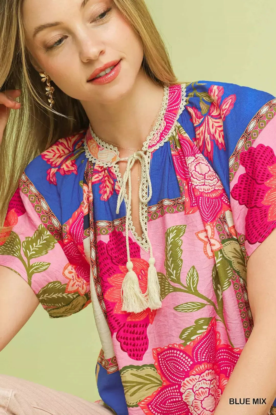 lightweight boho patchwork blouse with tassel tie neckline and floral-inspired print details