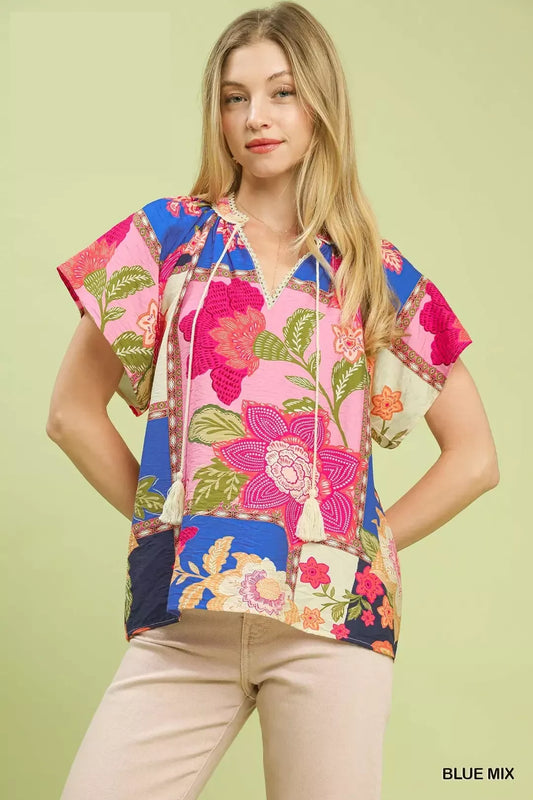 lightweight boho patchwork blouse with tassel tie neckline and floral-inspired print details