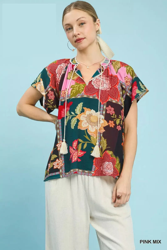 lightweight boho patchwork blouse with tassel tie neckline and floral-inspired print details
