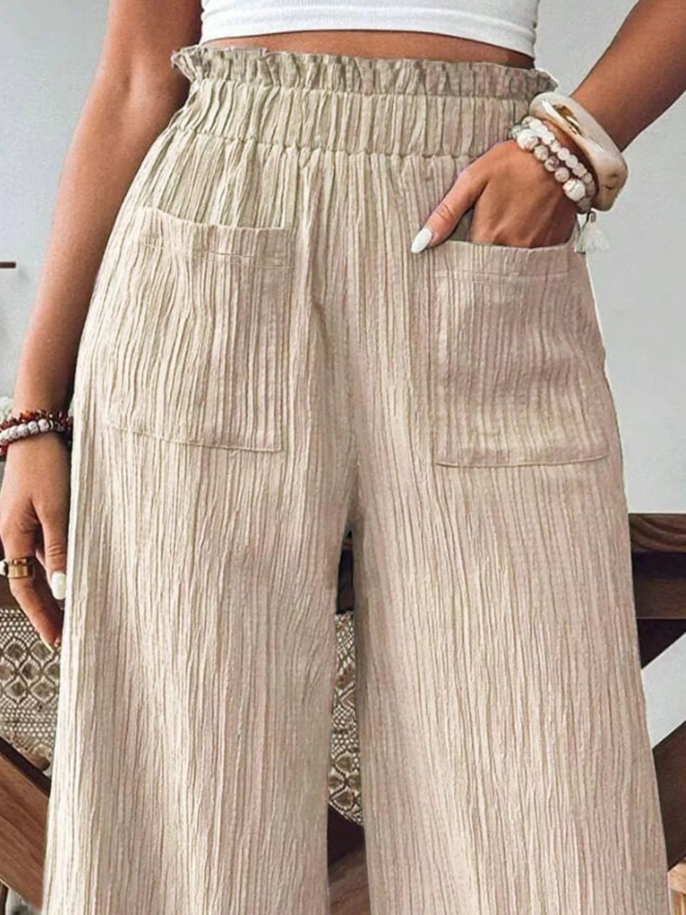 crinkle-textured wide-leg pants with ruched frill waistband and front pockets