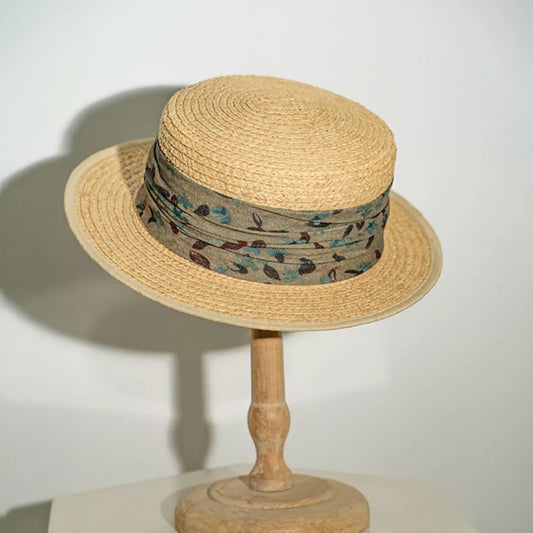 Structured straw hat with floral fabric band and flat brim