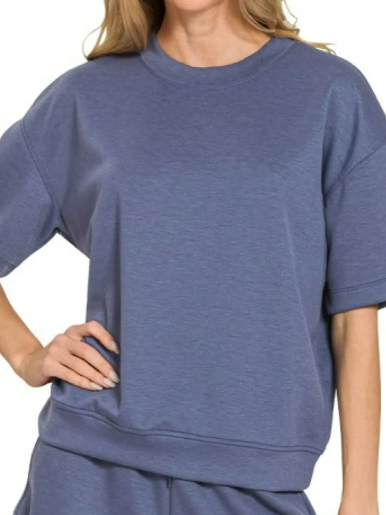 Woman wearing Zenana Scuba Short Sleeve Top and Shorts Set in blue indigo, casual oversized loungewear outfit