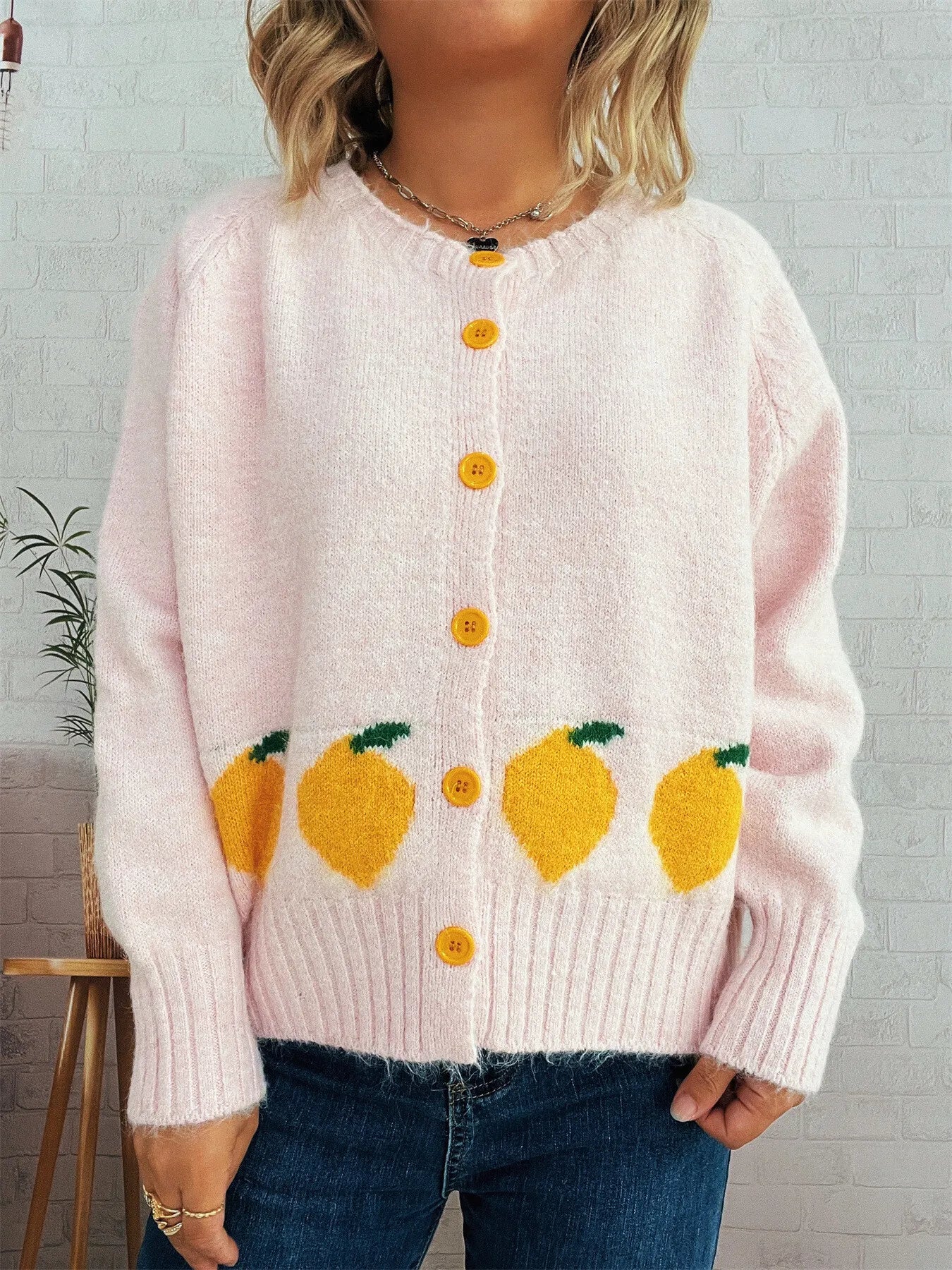 Pink button-up cardigan with playful lemon pattern – Zest & Bloom style from A Whimsical Affair.
