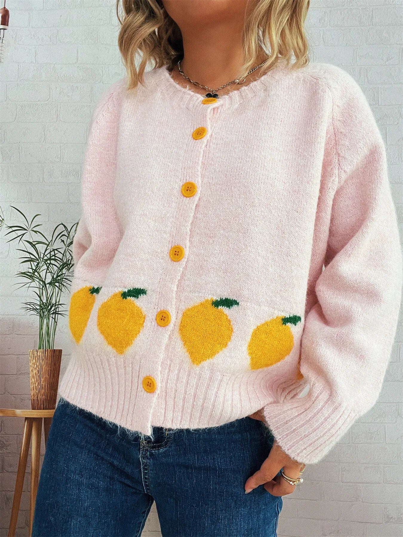 Pink button-up cardigan with playful lemon pattern – Zest & Bloom style from A Whimsical Affair.